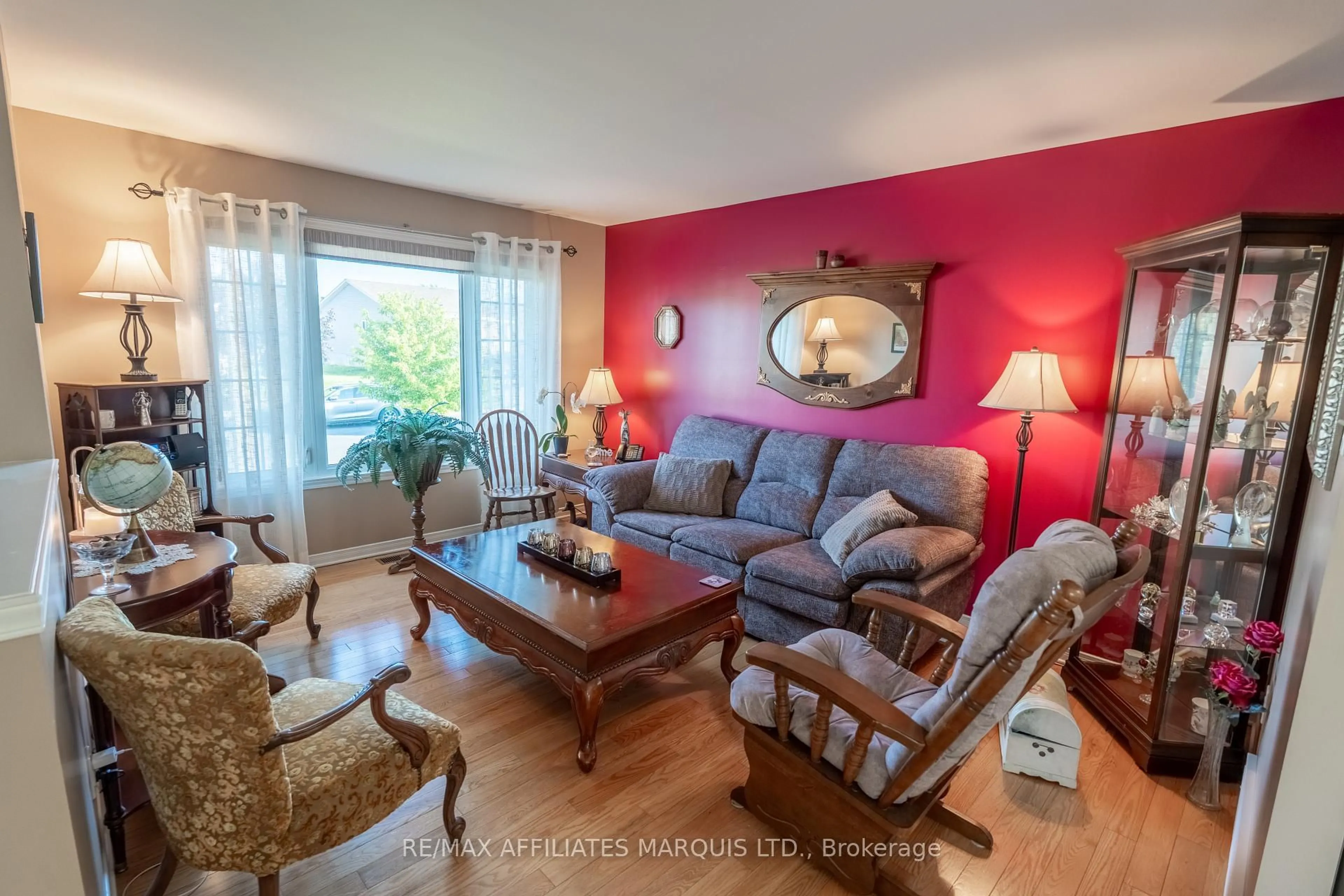 Living room with furniture, wood/laminate floor for 1851 Cumberland St, Cornwall Ontario K6J 0A1