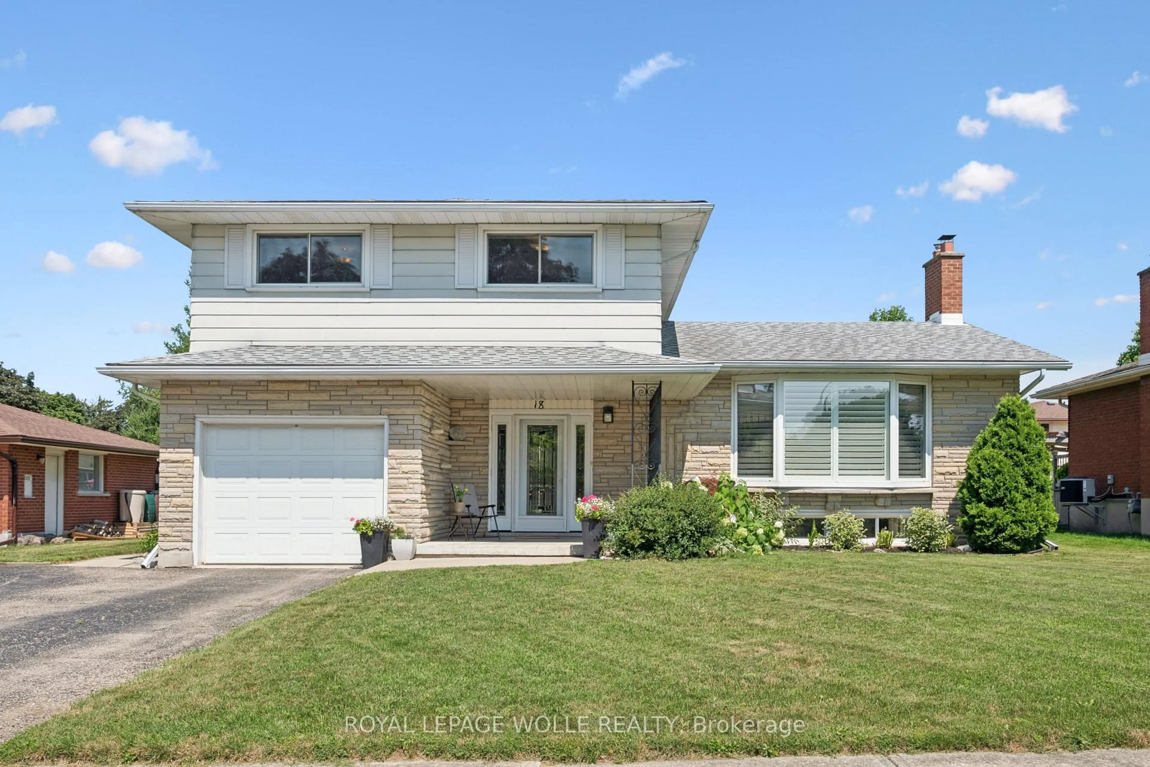 Home with brick exterior material, street for 18 Strathcona Cres, Kitchener Ontario N2B 2W6