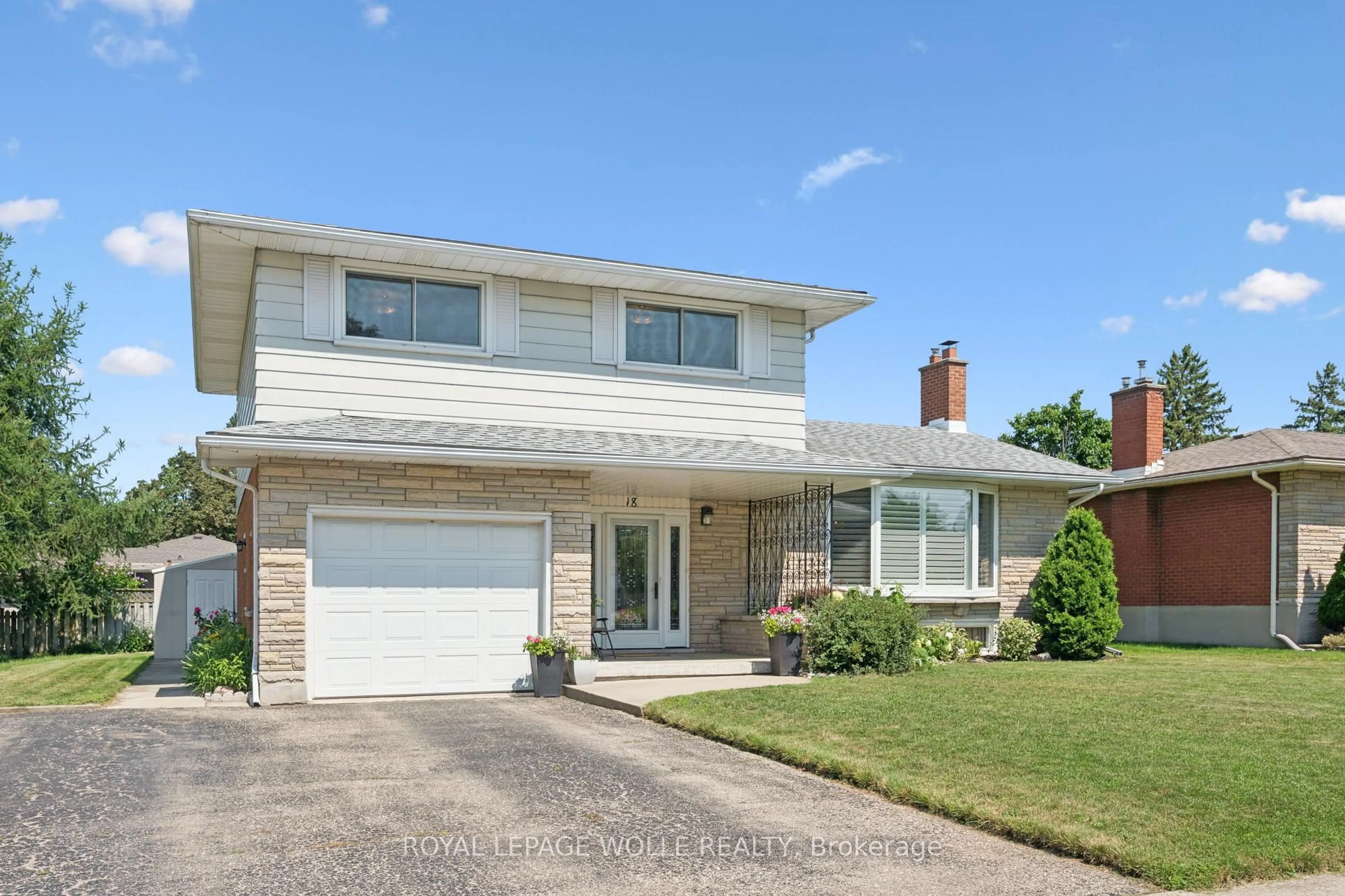 Home with brick exterior material, street for 18 Strathcona Cres, Kitchener Ontario N2B 2W6