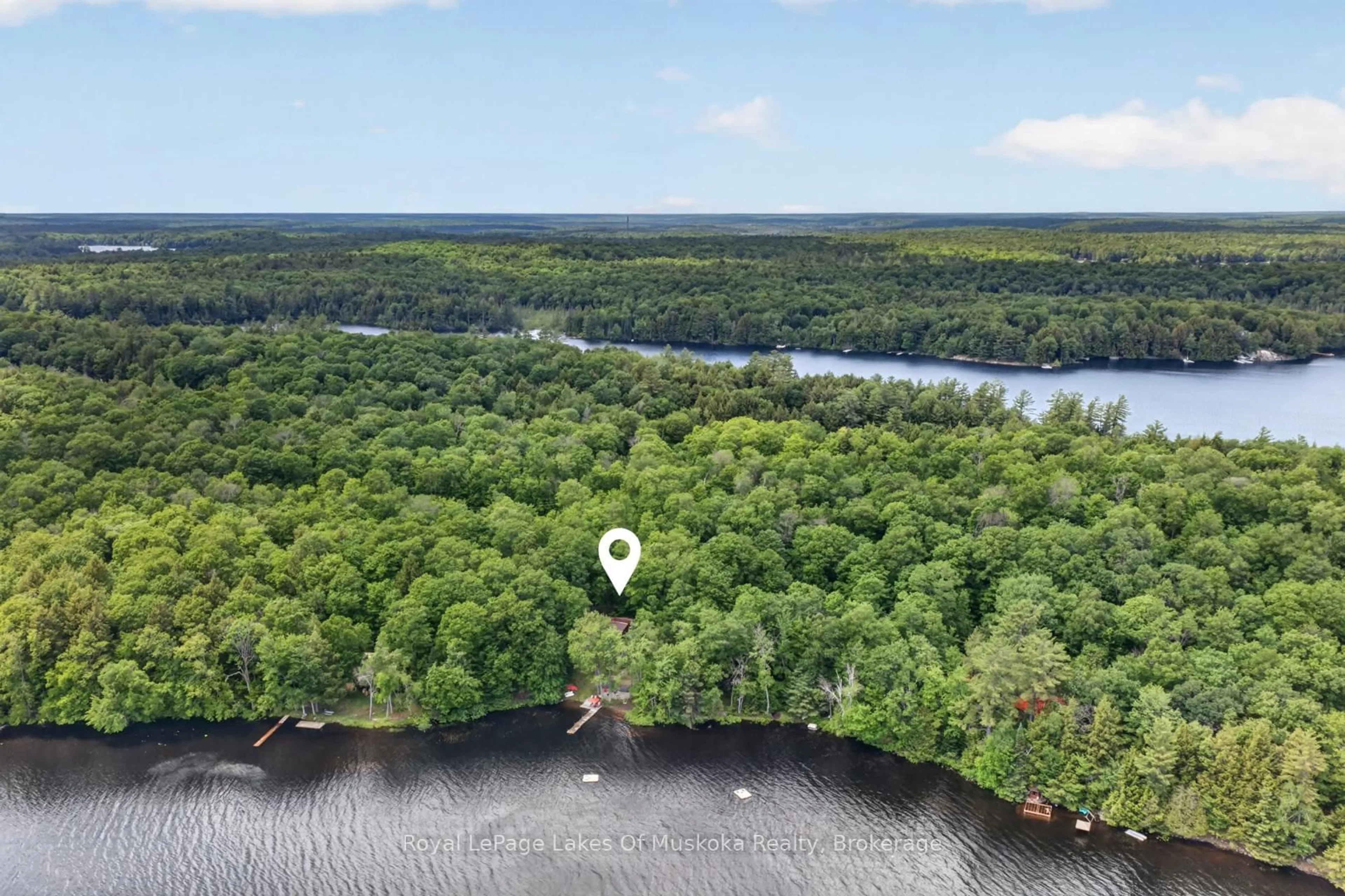A pic from outside/outdoor area/front of a property/back of a property/a pic from drone, water/lake/river/ocean view for 1008 Seven Dwarfs Cres, Bracebridge Ontario P1L 1X1
