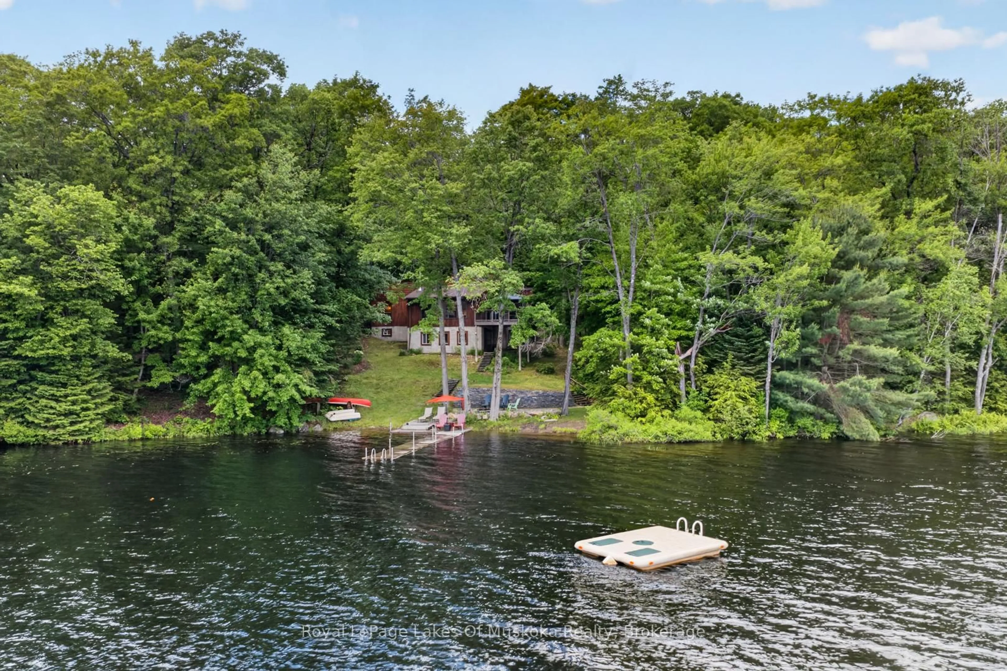 A pic from outside/outdoor area/front of a property/back of a property/a pic from drone, water/lake/river/ocean view for 1008 Seven Dwarfs Cres, Bracebridge Ontario P1L 1X1