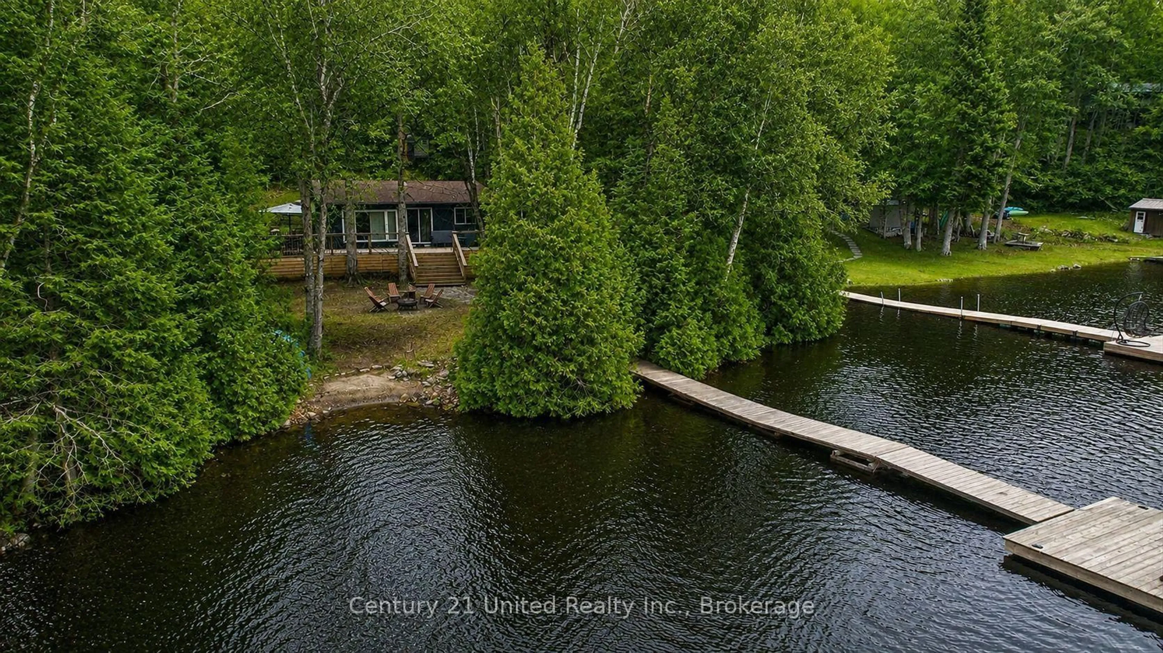 A pic from outside/outdoor area/front of a property/back of a property/a pic from drone, water/lake/river/ocean view for 1053 Esson Creek Lane, Highlands East Ontario K0L 3C0