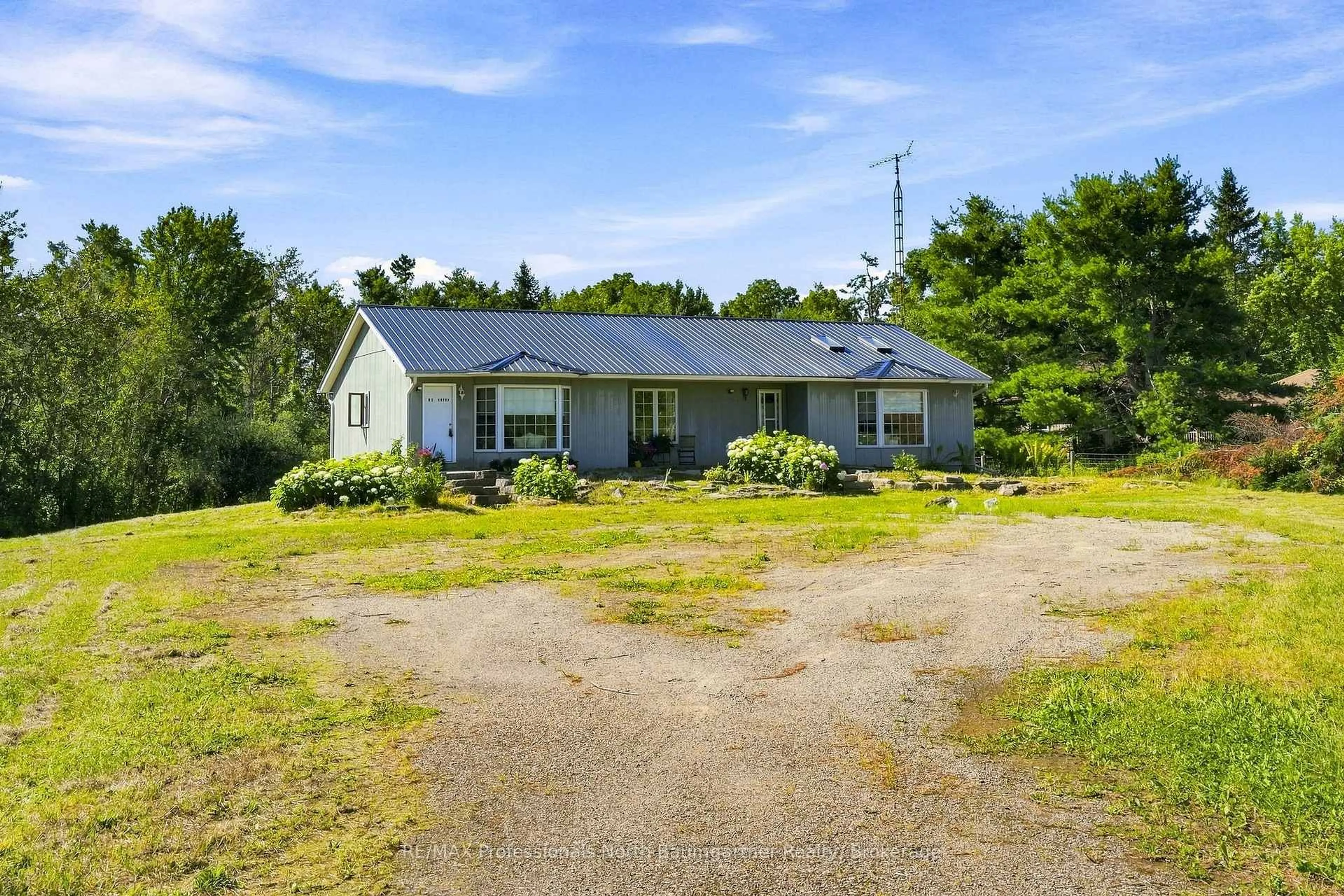 A pic from outside/outdoor area/front of a property/back of a property/a pic from drone, building for 8966 Highway 35, Minden Hills Ontario K0M 2L1
