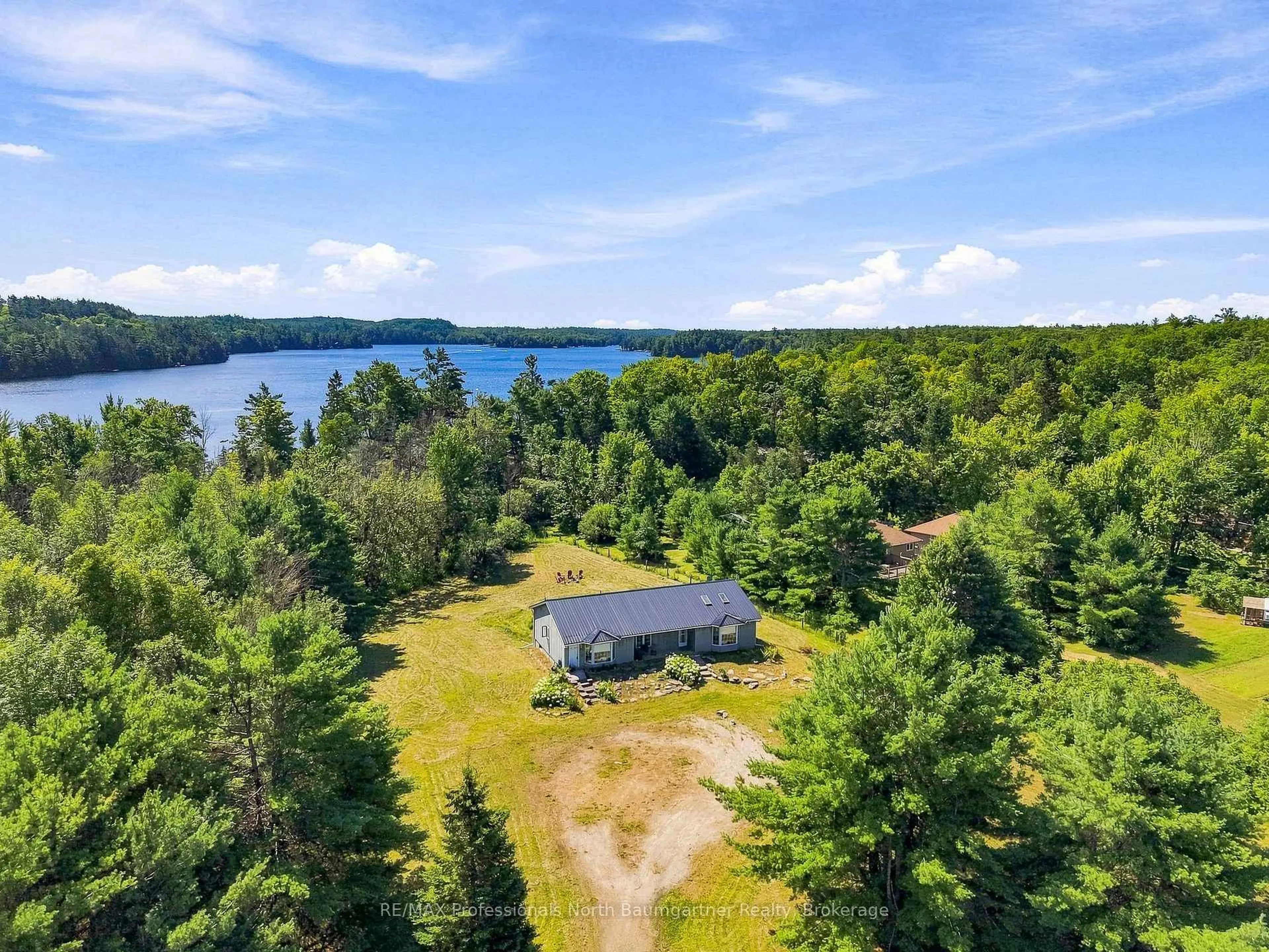 A pic from outside/outdoor area/front of a property/back of a property/a pic from drone, water/lake/river/ocean view for 8966 Highway 35, Minden Hills Ontario K0M 2L1