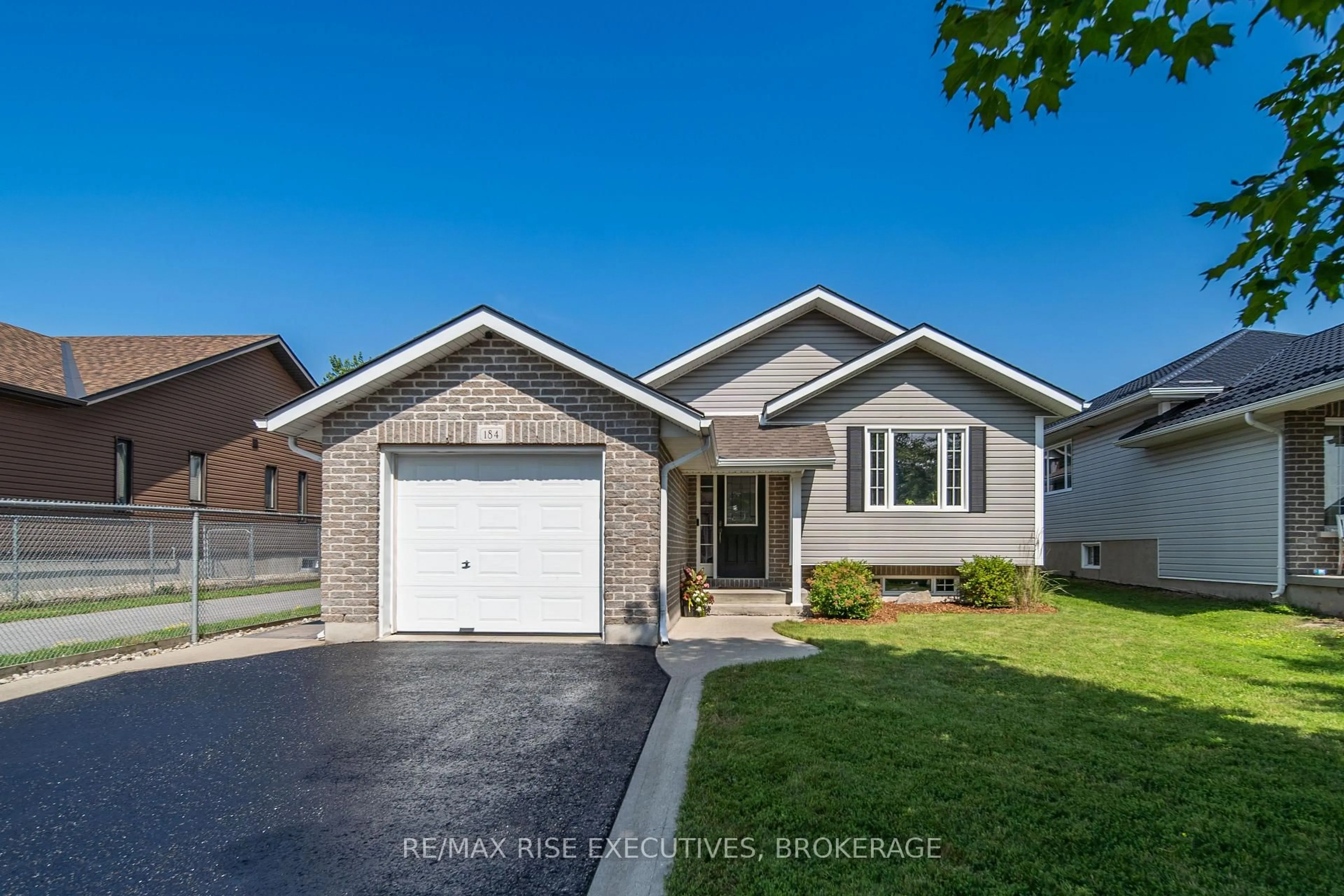 Home with vinyl exterior material, street for 184 MacDougall Dr, Loyalist Ontario K7N 1Y8
