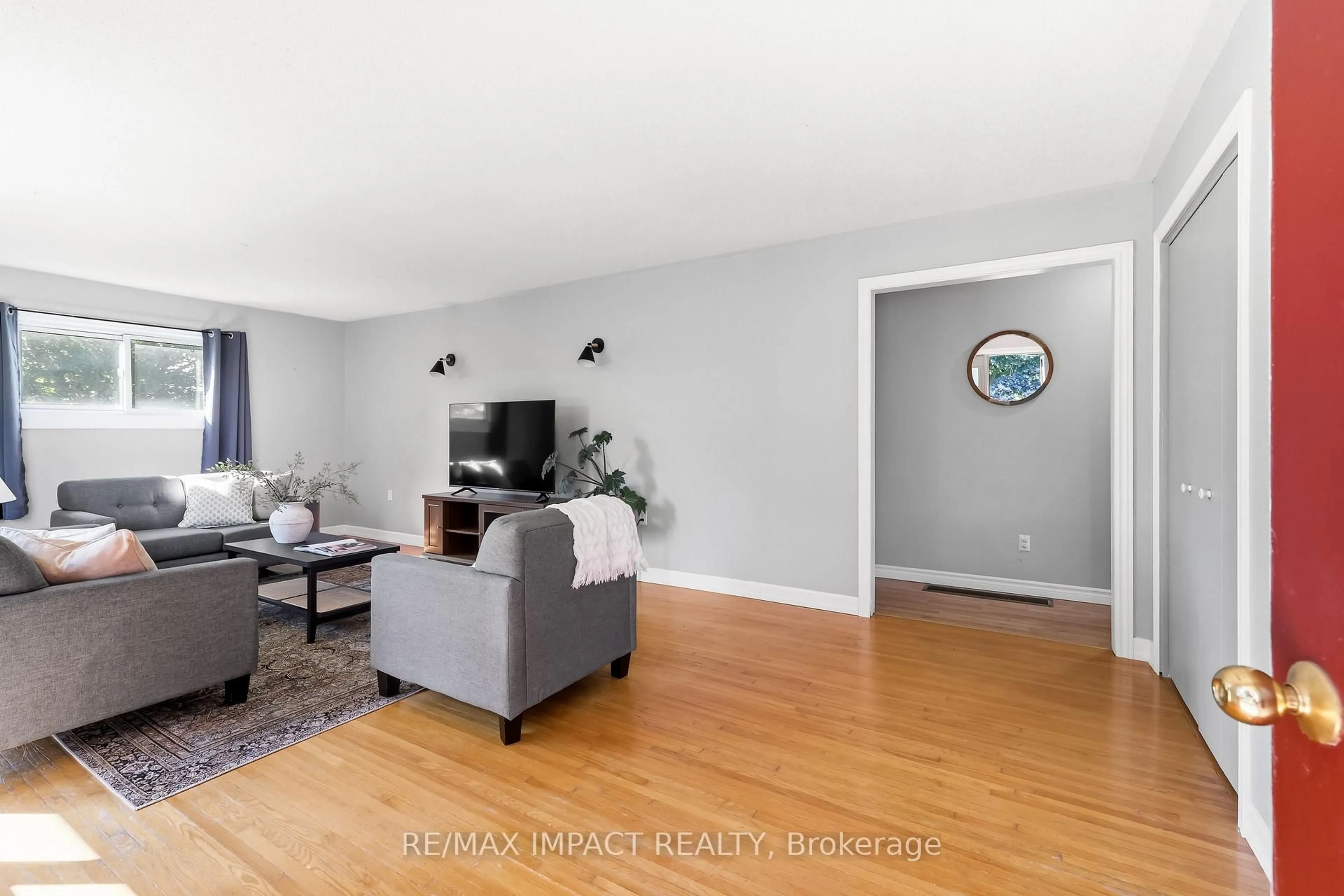 Living room with furniture, wood/laminate floor for 130 Keeler Rd, Cramahe Ontario K0K 1S0