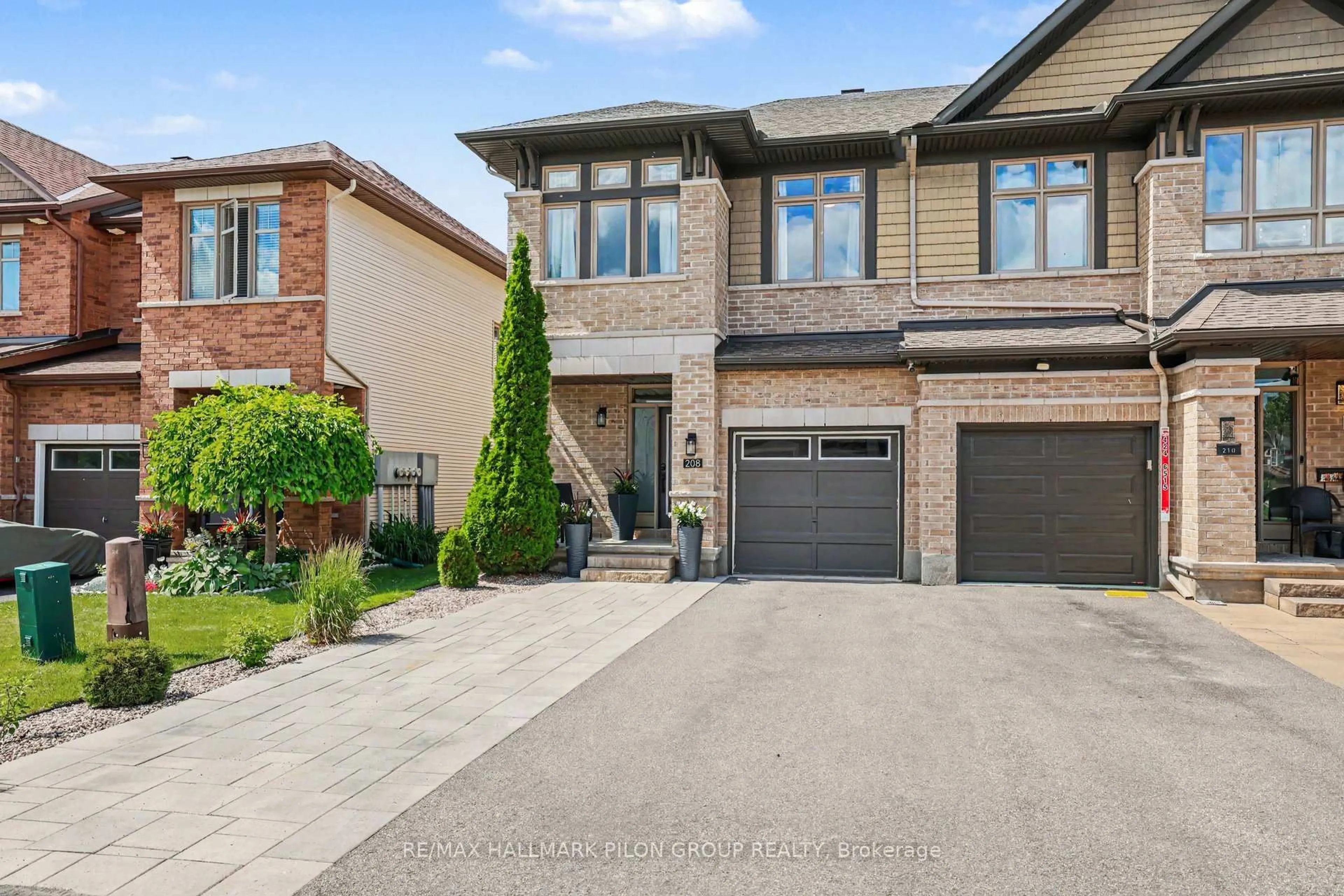 Home with brick exterior material, street for 208 Butterfly Walk, Ottawa Ontario K1W 0G6