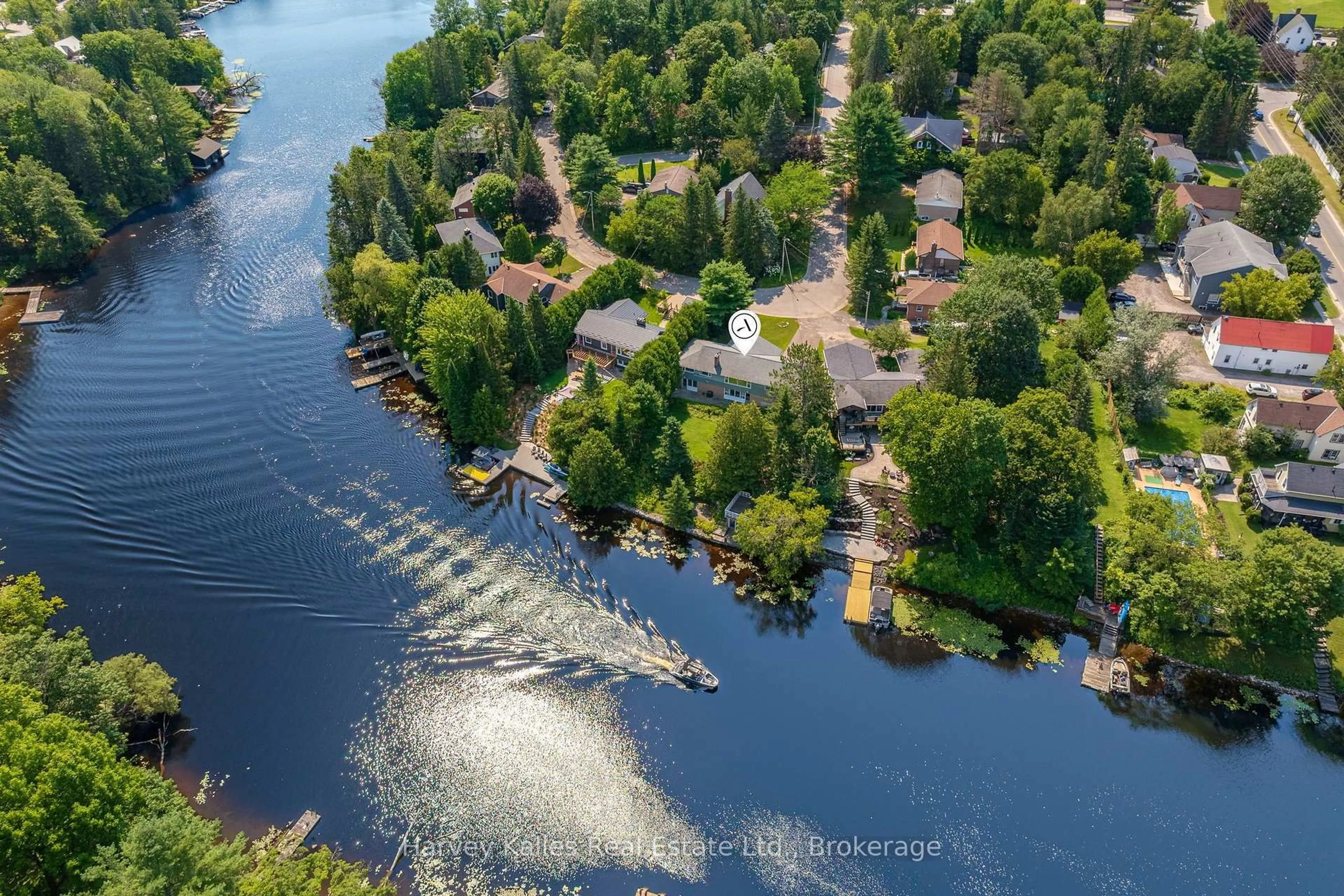 A pic from outside/outdoor area/front of a property/back of a property/a pic from drone, water/lake/river/ocean view for 40 King Cres, Huntsville Ontario P1H 1X6