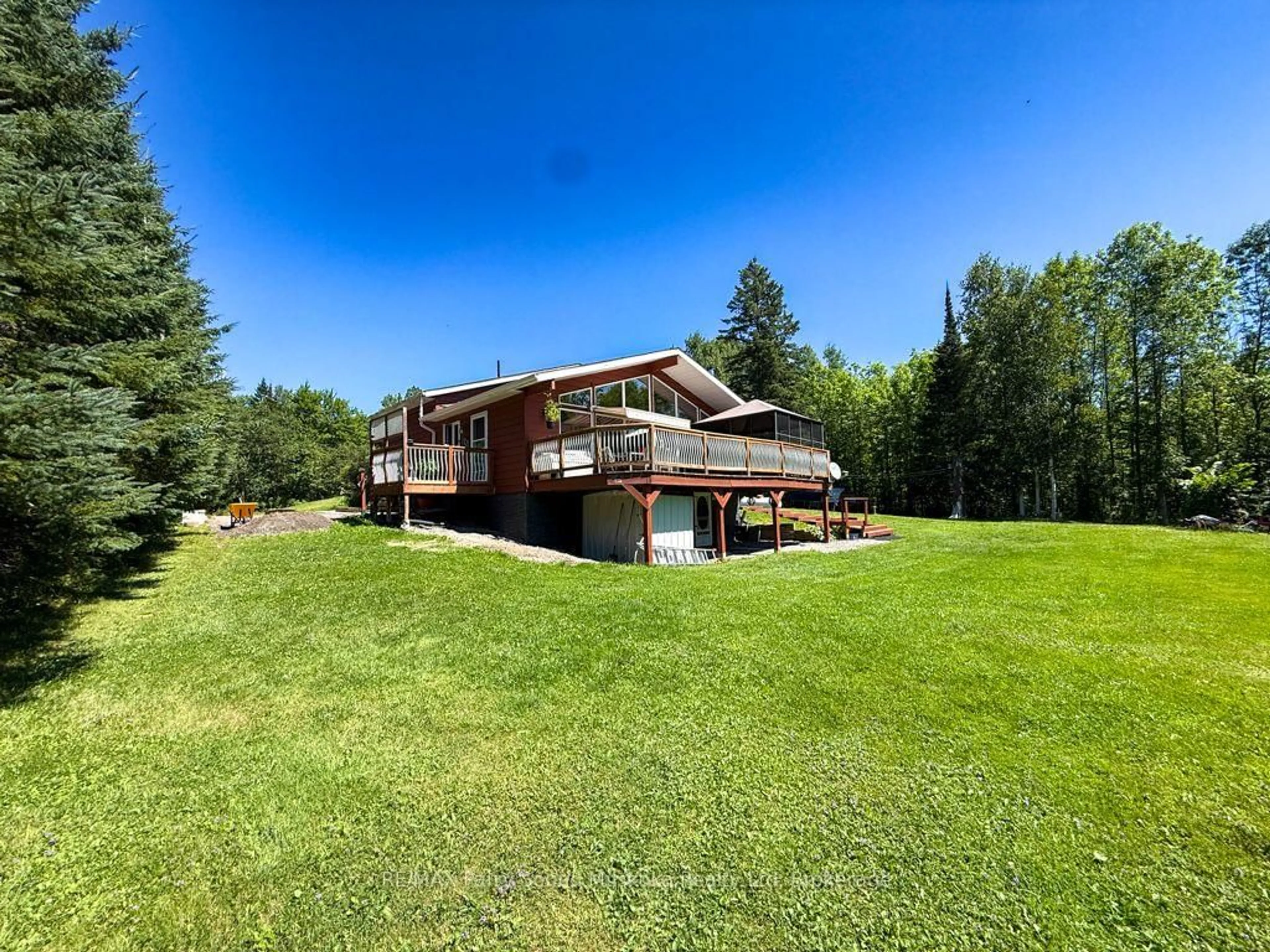 A pic from outside/outdoor area/front of a property/back of a property/a pic from drone, water/lake/river/ocean view for 4031 Highway 520 Highway, Magnetawan Ontario P0A 1C0