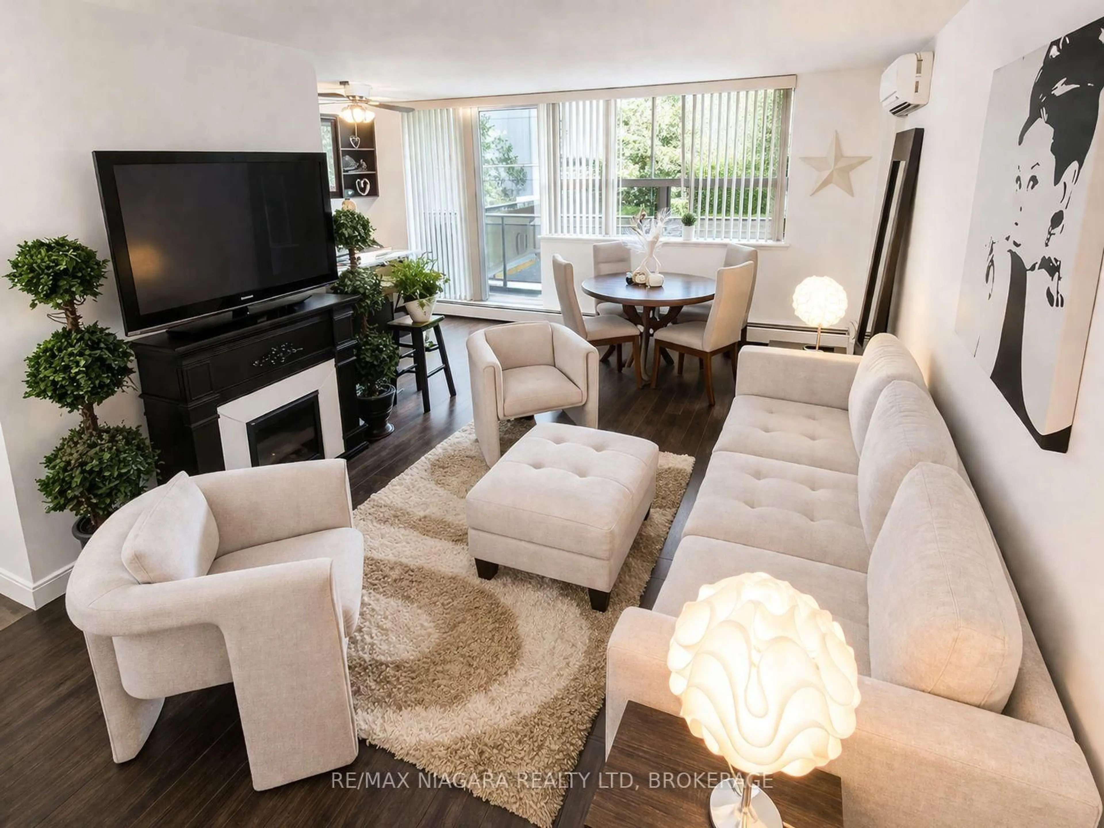 Living room with furniture, unknown for 6390 Huggins St #205, Niagara Falls Ontario L2J 1H1
