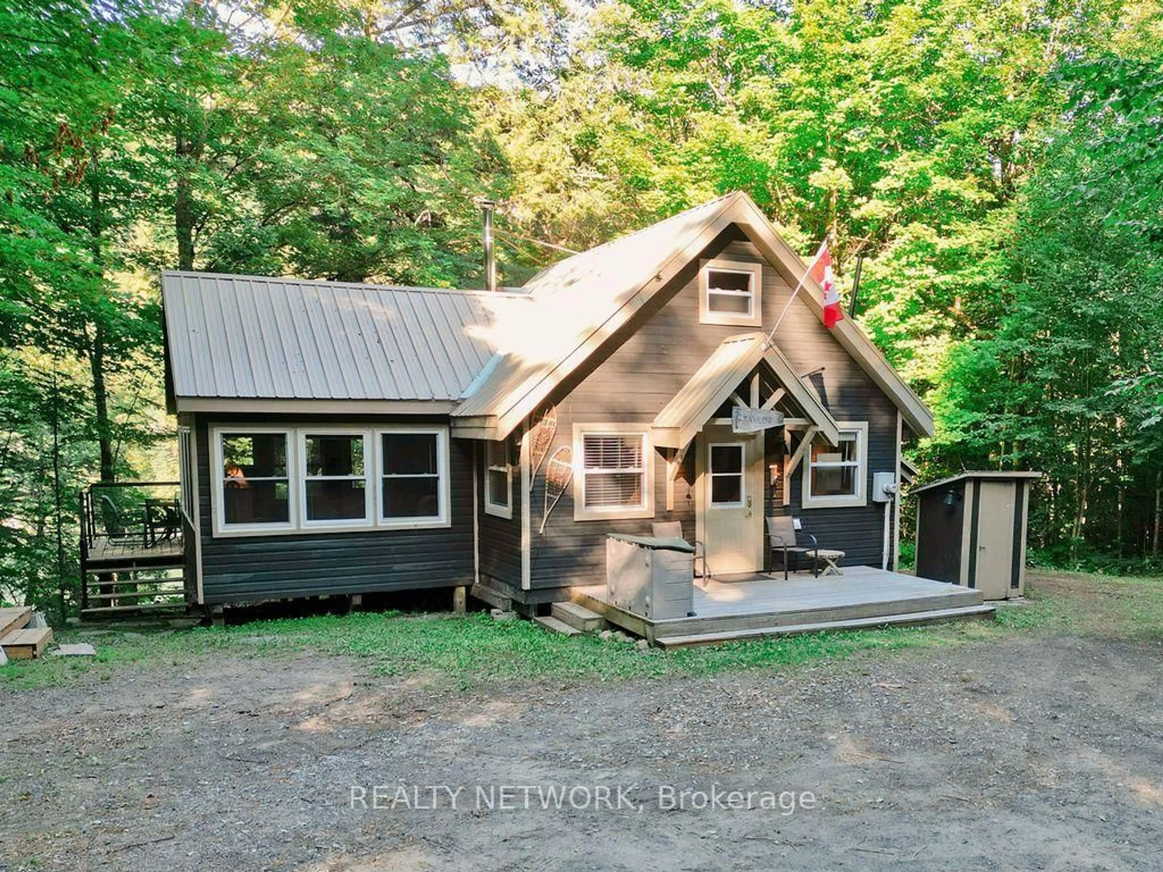 Home with vinyl exterior material, street for 1123 Blue Lake Rd, Lake of Bays Ontario P1H 2J6