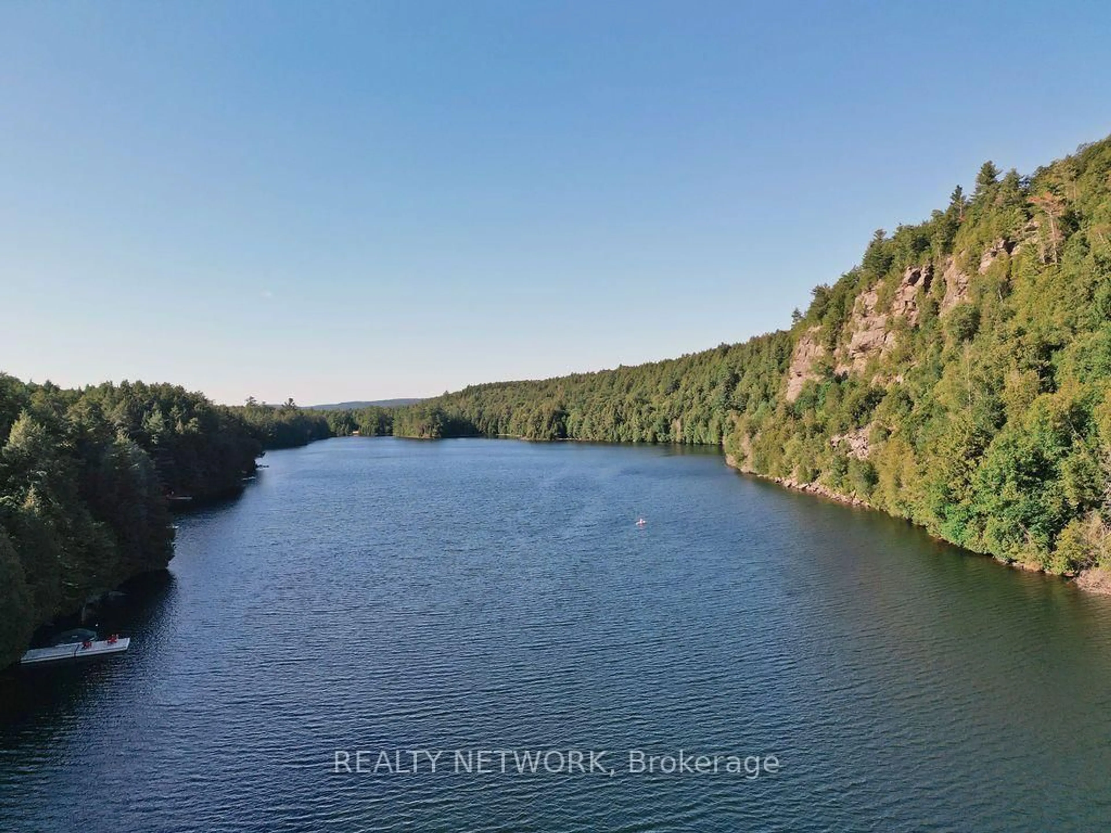 A pic from outside/outdoor area/front of a property/back of a property/a pic from drone, water/lake/river/ocean view for 1123 Blue Lake Rd, Lake of Bays Ontario P1H 2J6