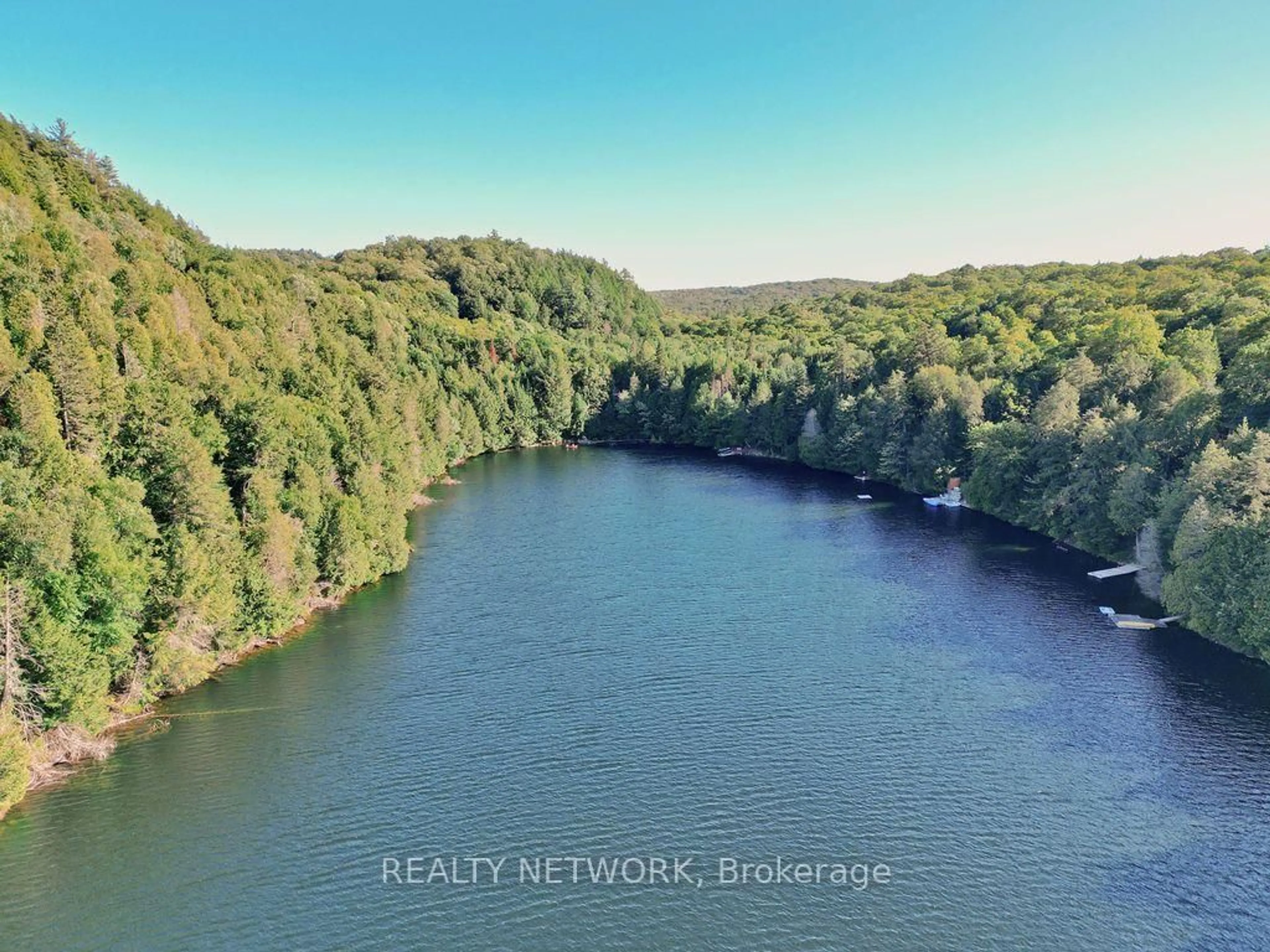 A pic from outside/outdoor area/front of a property/back of a property/a pic from drone, water/lake/river/ocean view for 1123 Blue Lake Rd, Lake of Bays Ontario P1H 2J6