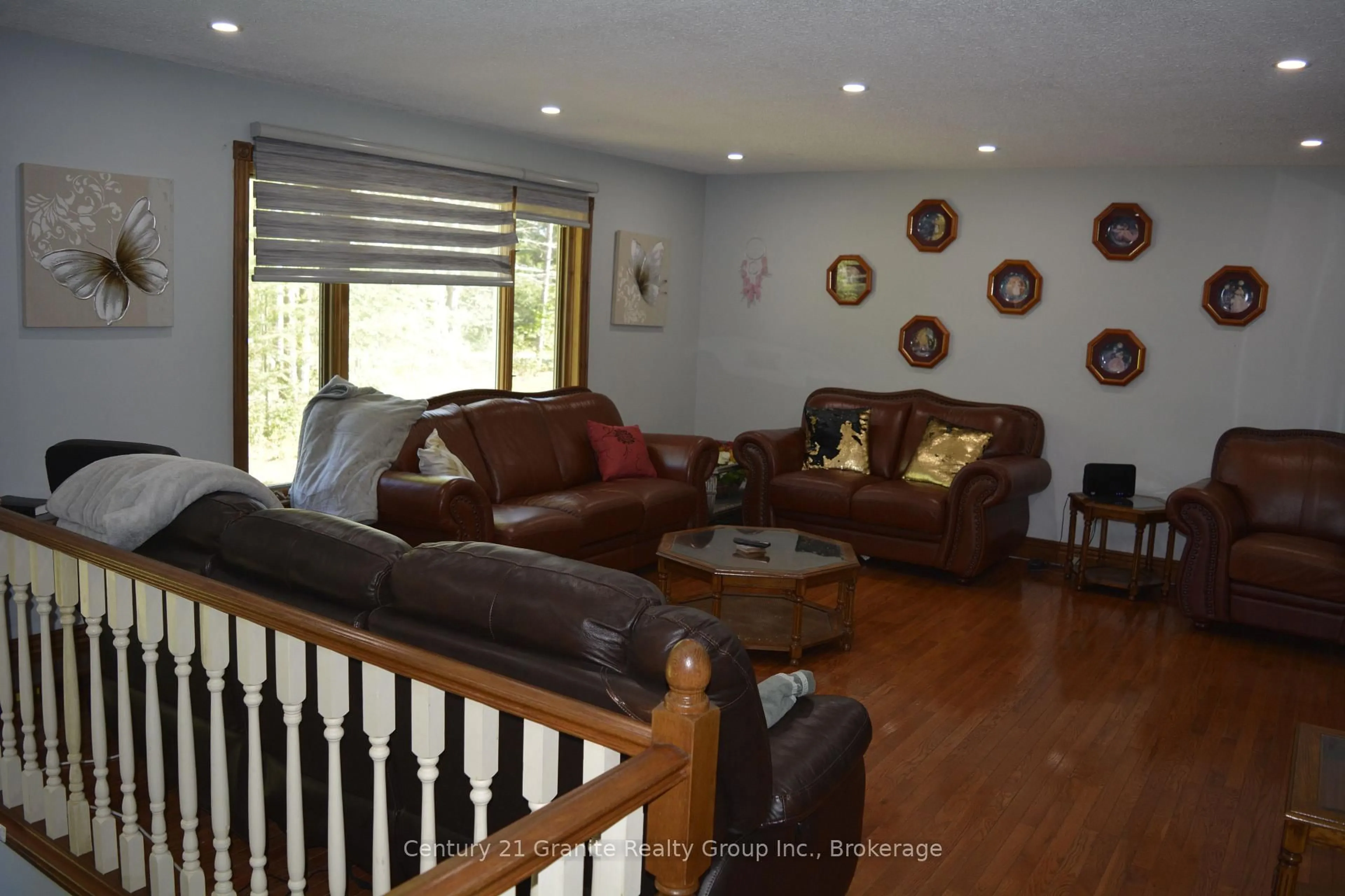 Living room with furniture, wood/laminate floor for 107 South Baptiste Lake Rd, Bancroft Ontario K0L 1C0