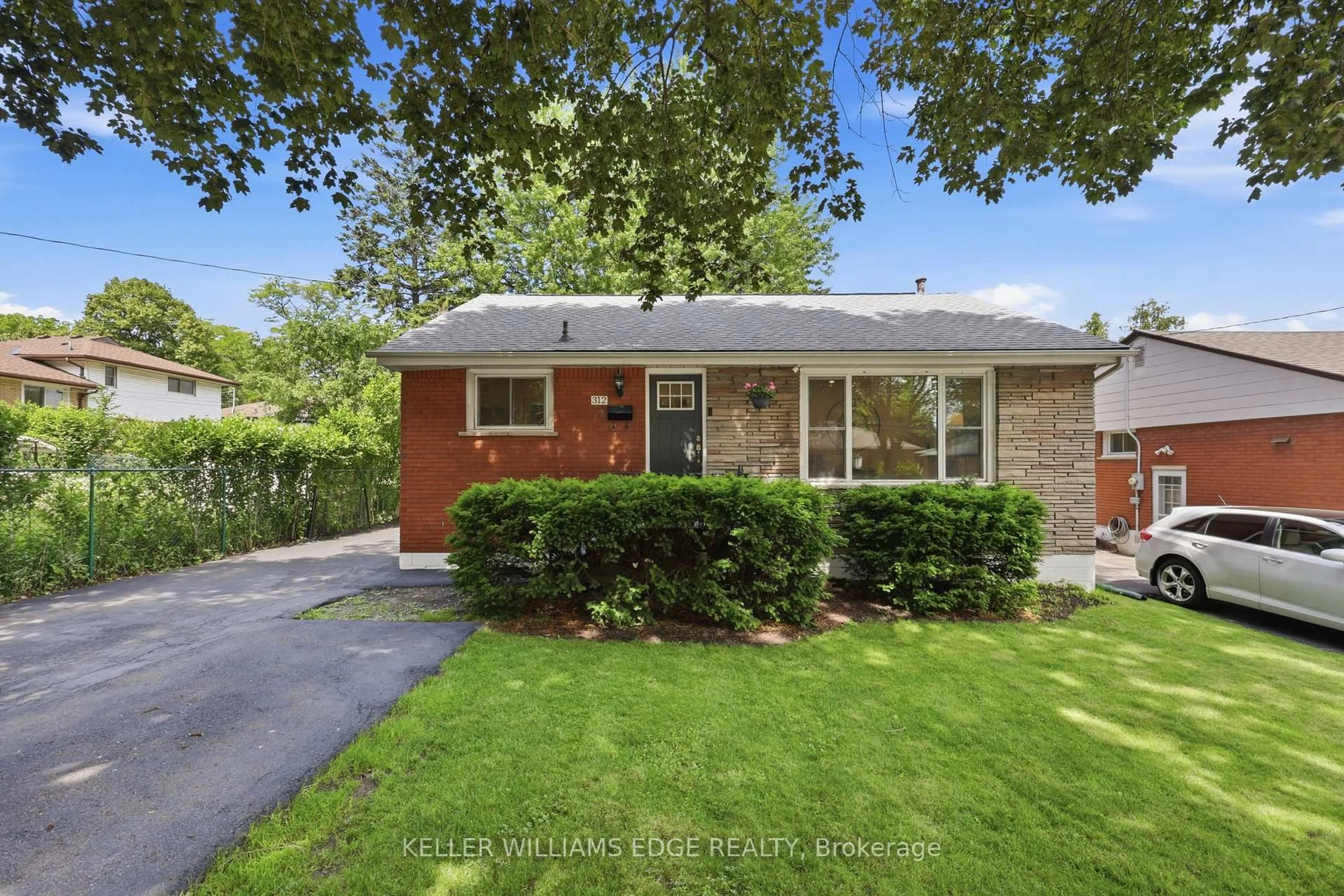 Home with brick exterior material, street for 312 Upper Paradise Rd, Hamilton Ontario L9C 5C4