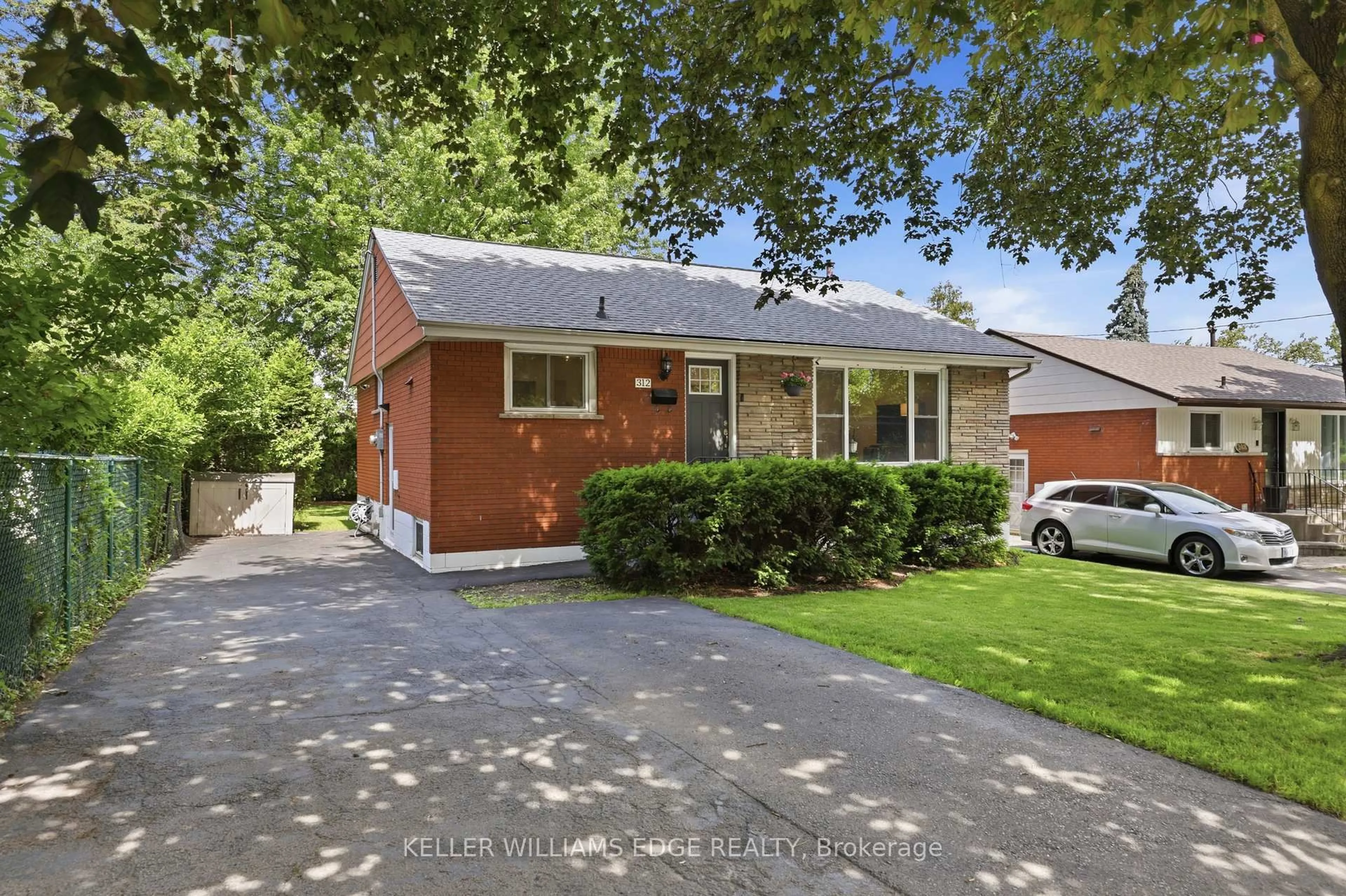 Home with brick exterior material, street for 312 Upper Paradise Rd, Hamilton Ontario L9C 5C4