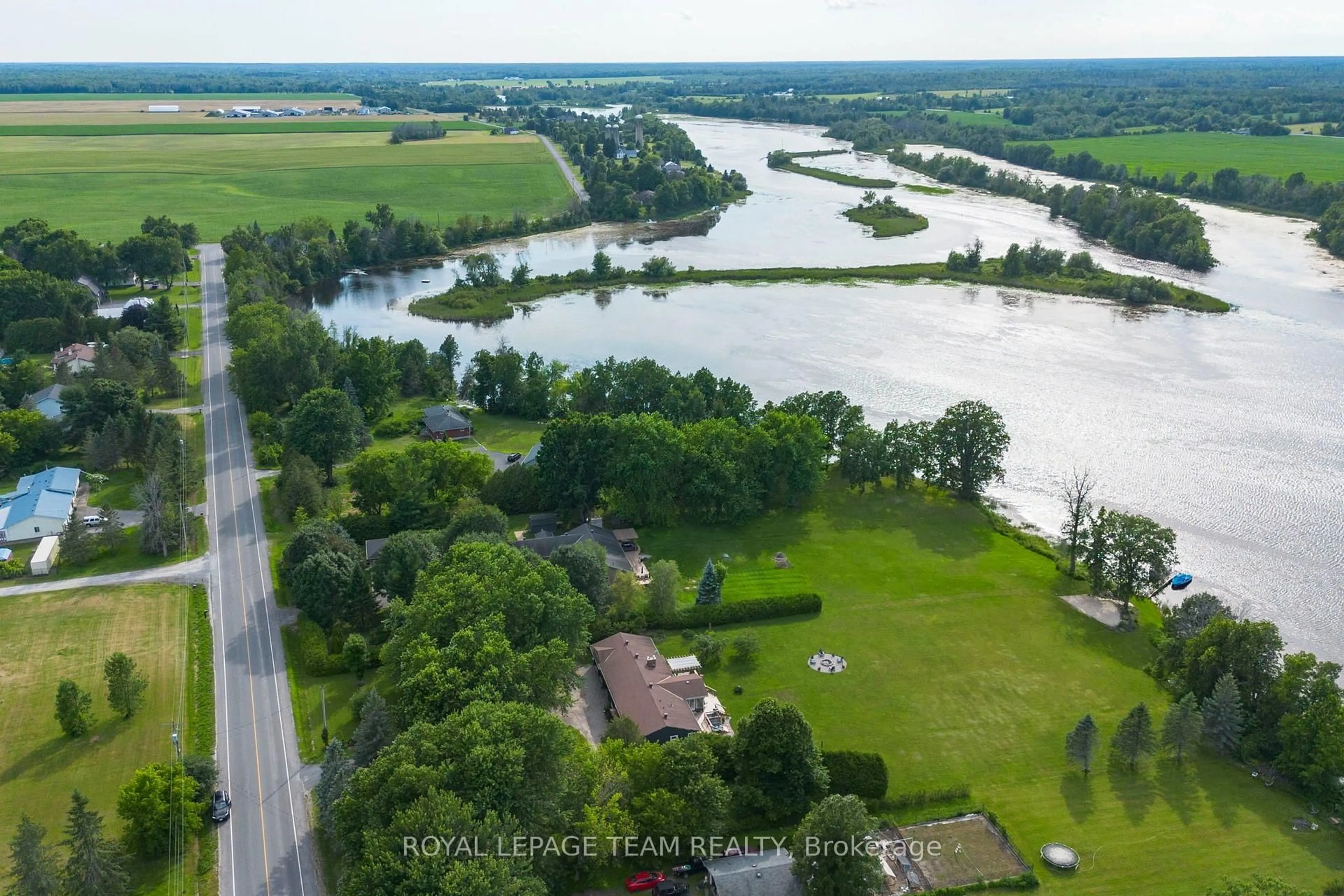 A pic from outside/outdoor area/front of a property/back of a property/a pic from drone, water/lake/river/ocean view for 1683 River Rd, North Grenville Ontario K0G 1J0