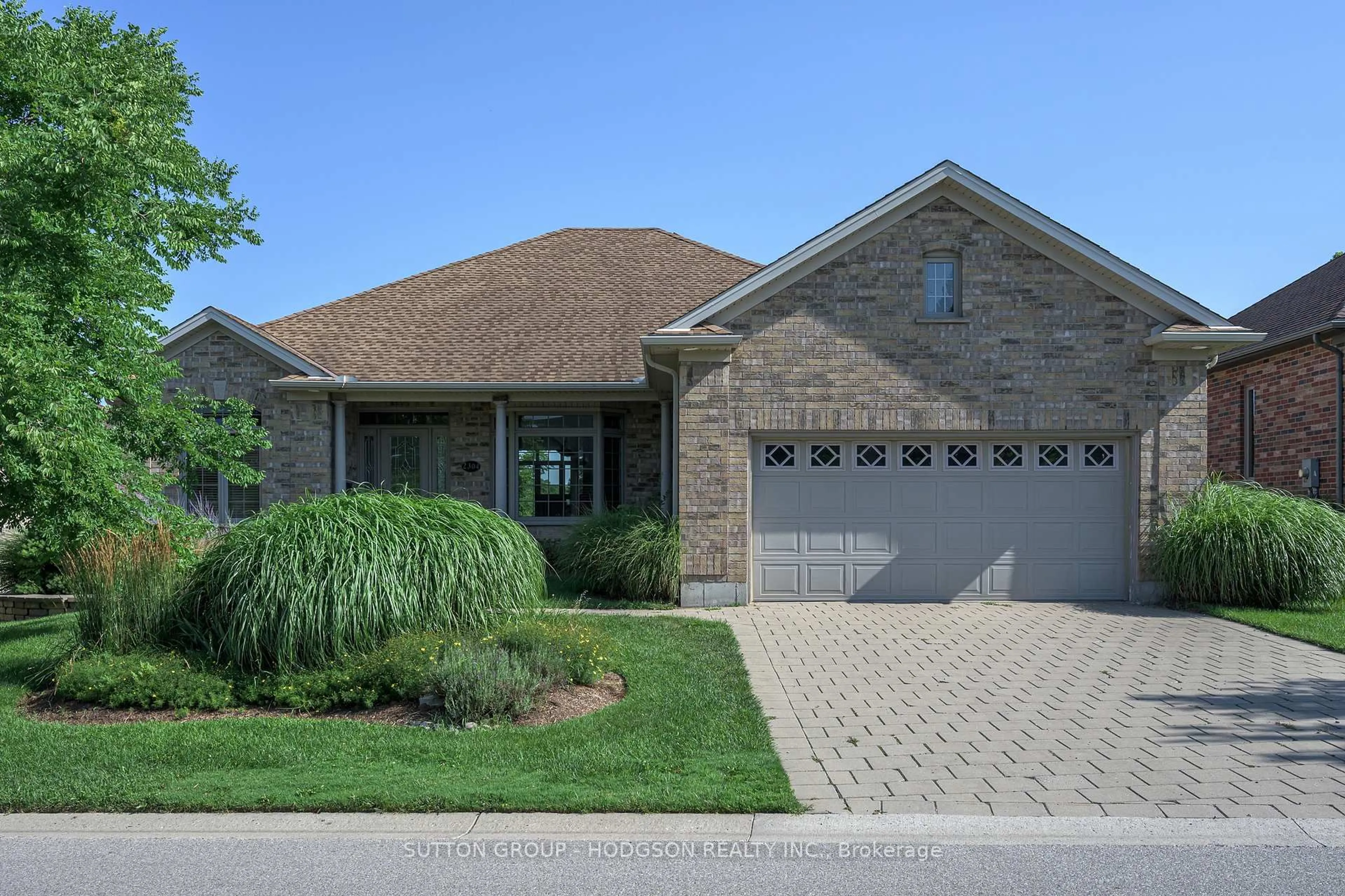 Home with brick exterior material, street for 2304 Jack Nash Dr, London South Ontario N6K 5R3