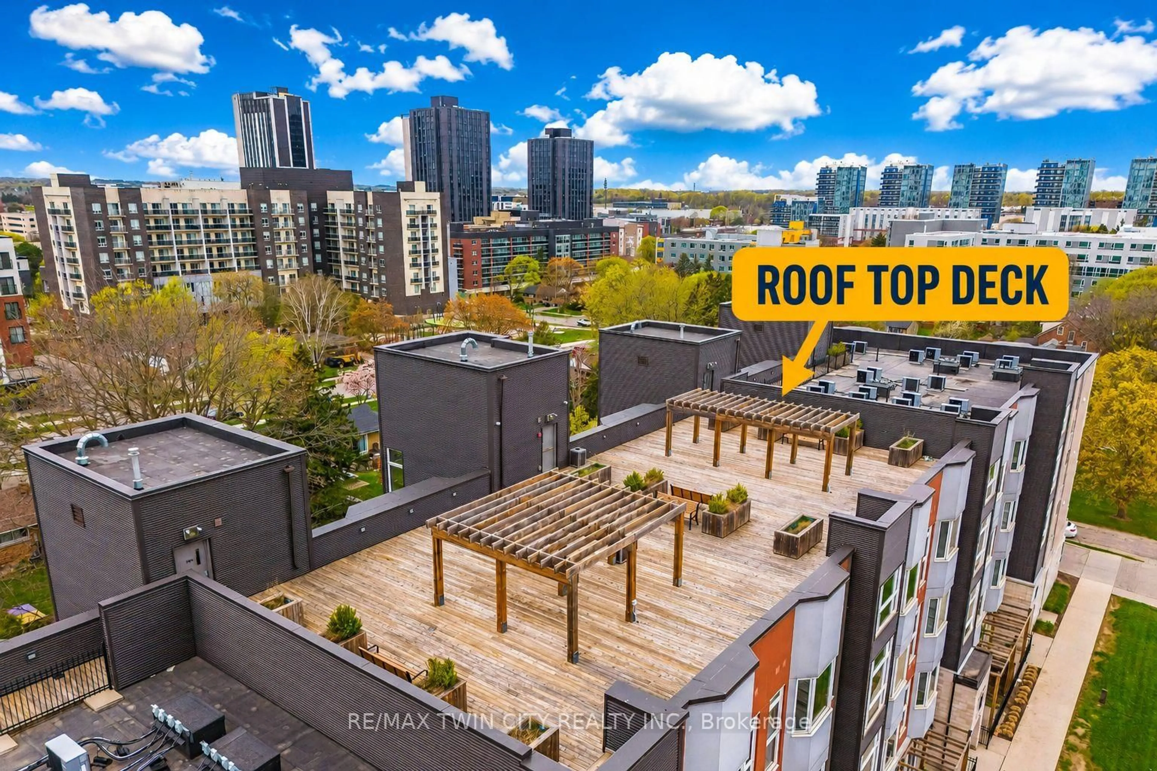 A pic from outside/outdoor area/front of a property/back of a property/a pic from drone, city buildings view from balcony for 253 Albert St #103, Waterloo Ontario N2L 3T7