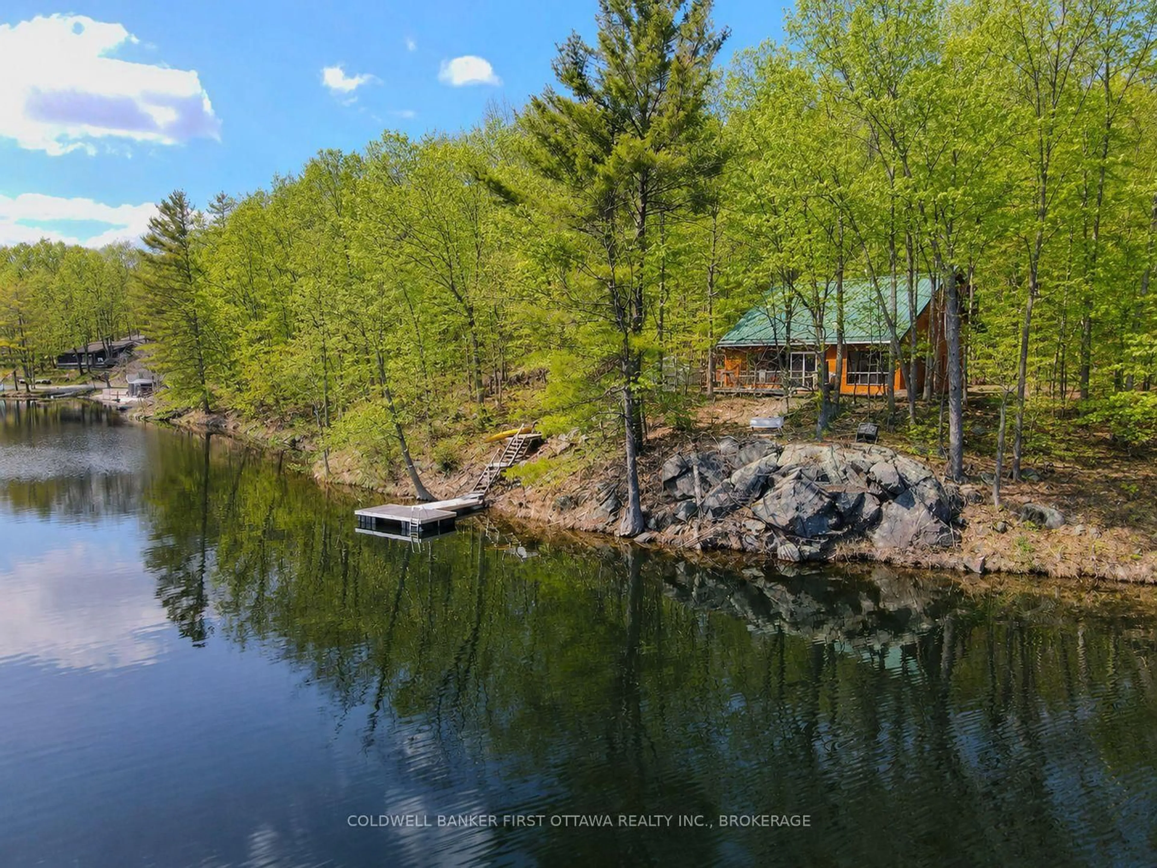 A pic from outside/outdoor area/front of a property/back of a property/a pic from drone, water/lake/river/ocean view for 2238 Little Long Lake Rd, Sydenham Ontario K0H 2T0
