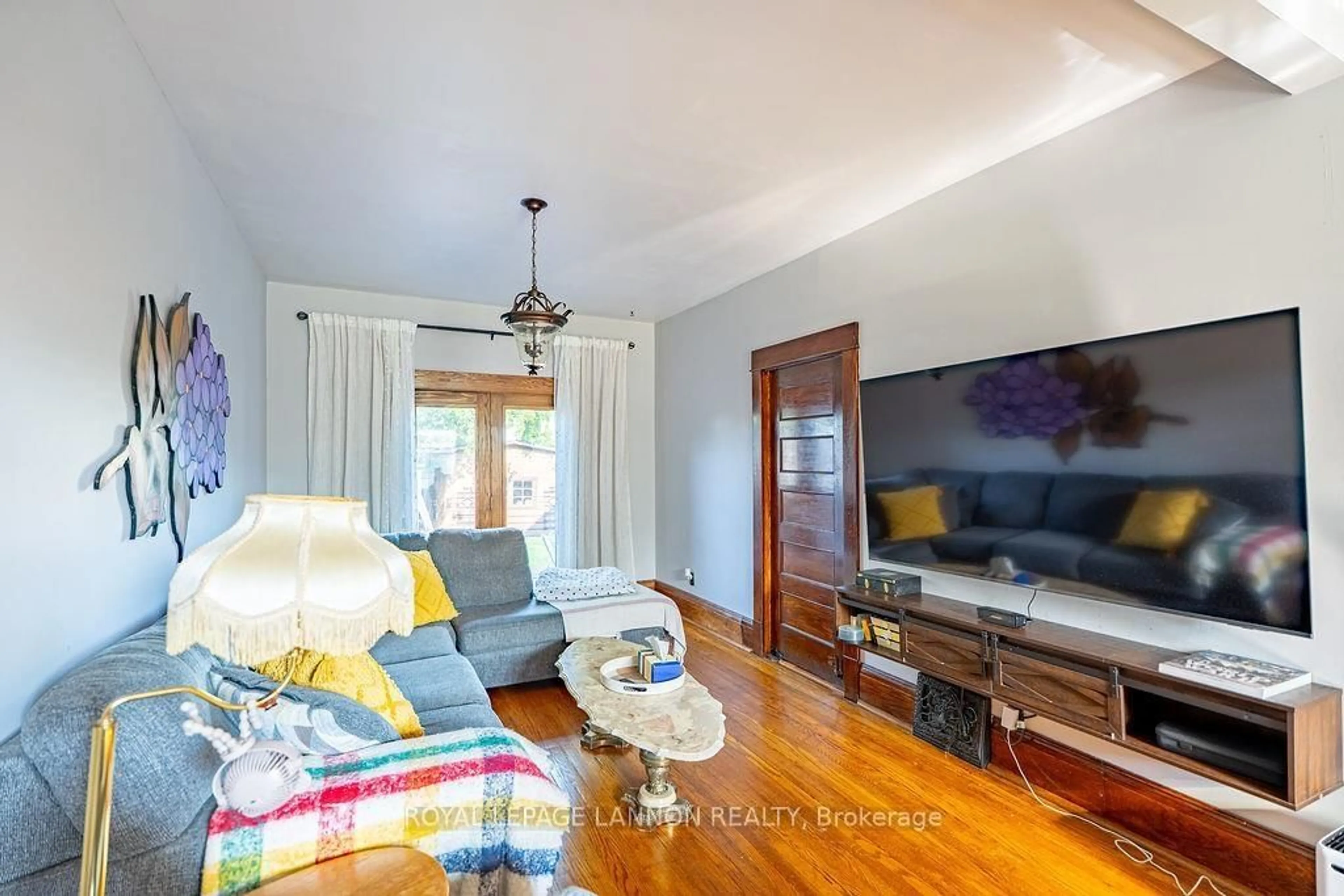 Living room with furniture, wood/laminate floor for 637 Catherine St., Thunder Bay Ontario P7E 1L4