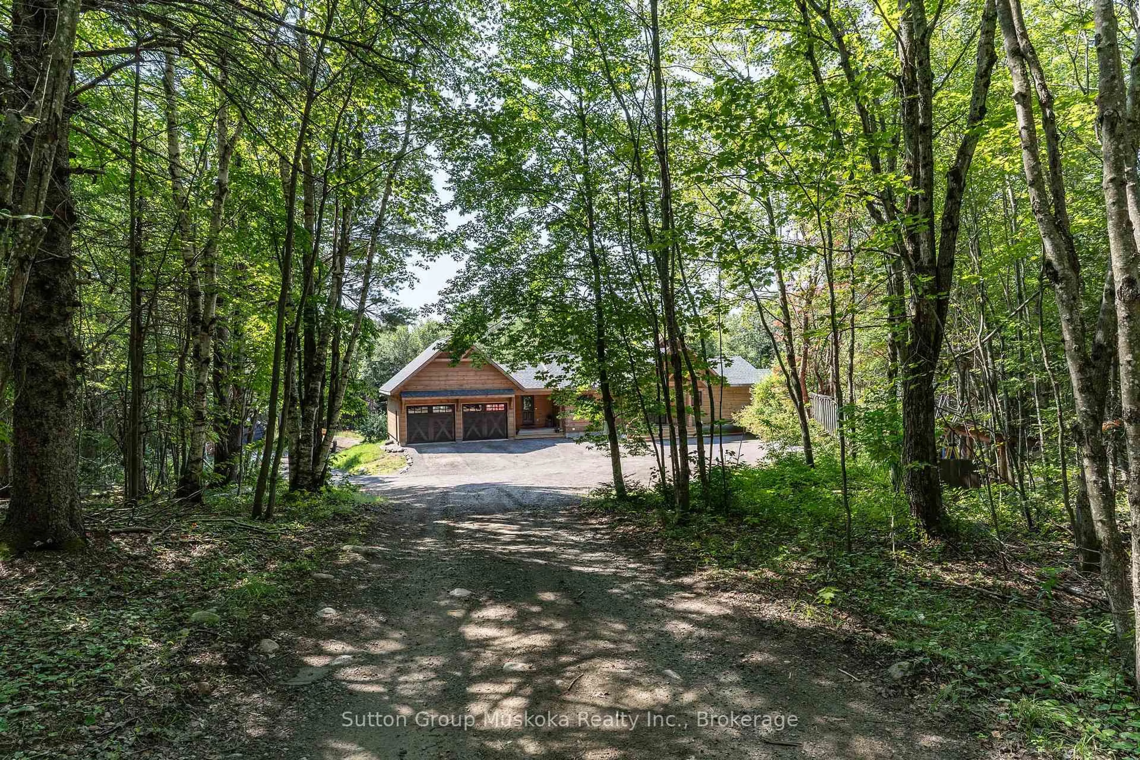 A pic from outside/outdoor area/front of a property/back of a property/a pic from drone, forest/trees view for 1265 Britannia Rd, Huntsville Ontario P1H 2J3