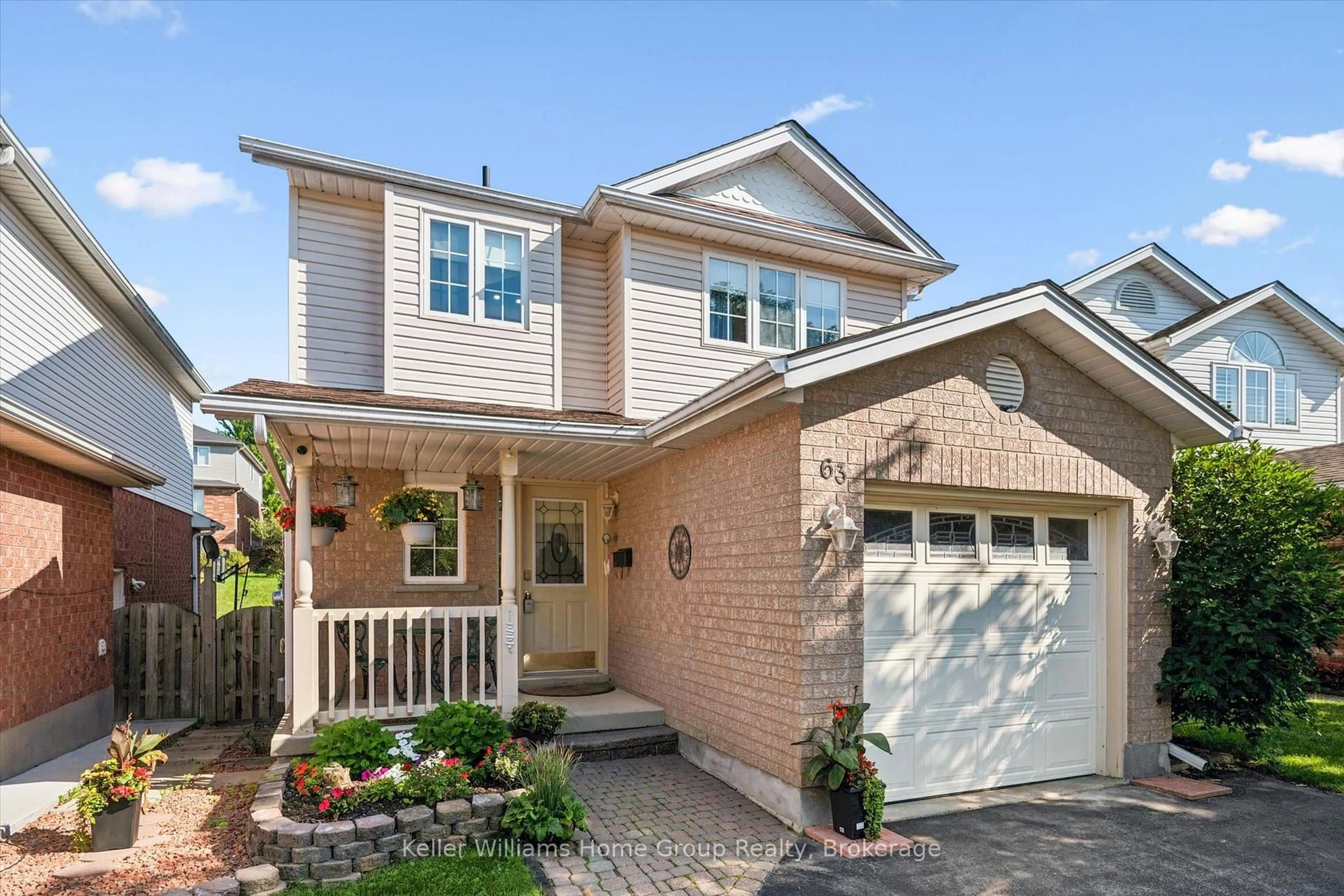 Home with brick exterior material, street for 63 Boulder Cres, Guelph Ontario N1G 5A2