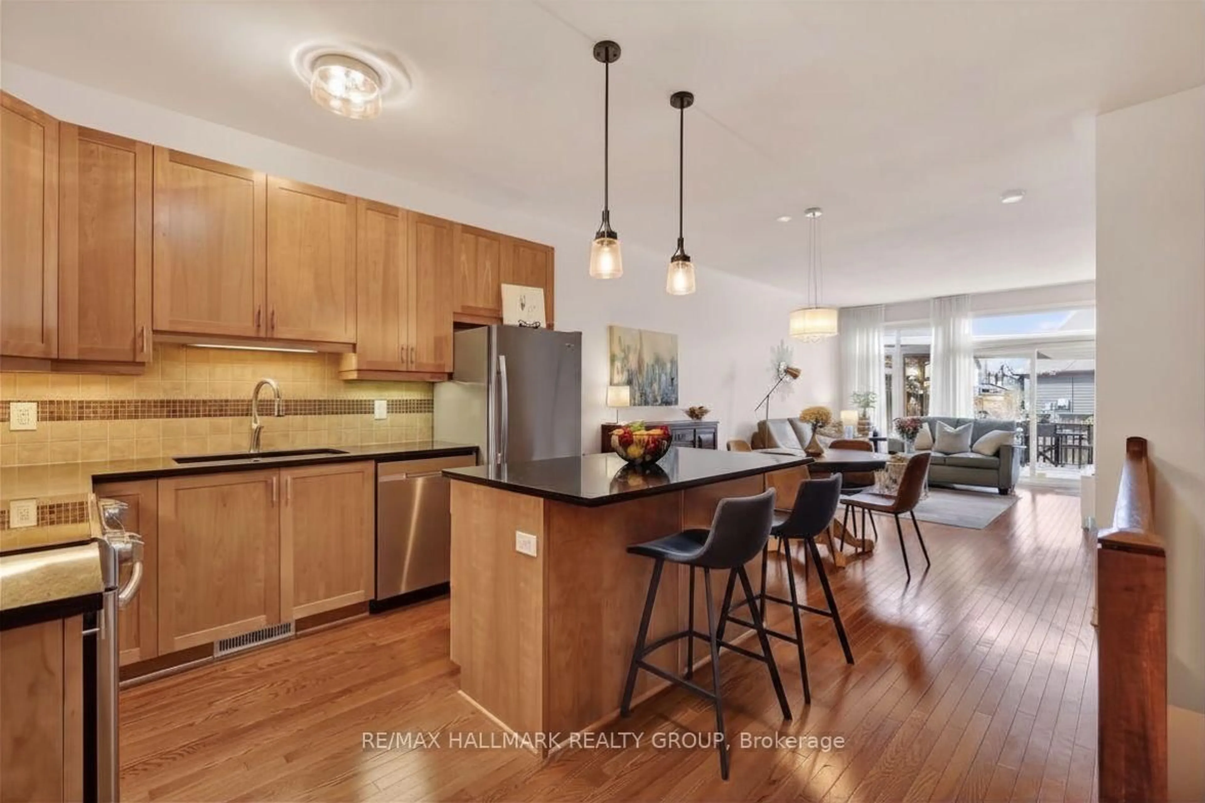 Open concept kitchen, wood/laminate floor for 236 Bulrush Cres, Ottawa Ontario K1T 0E6