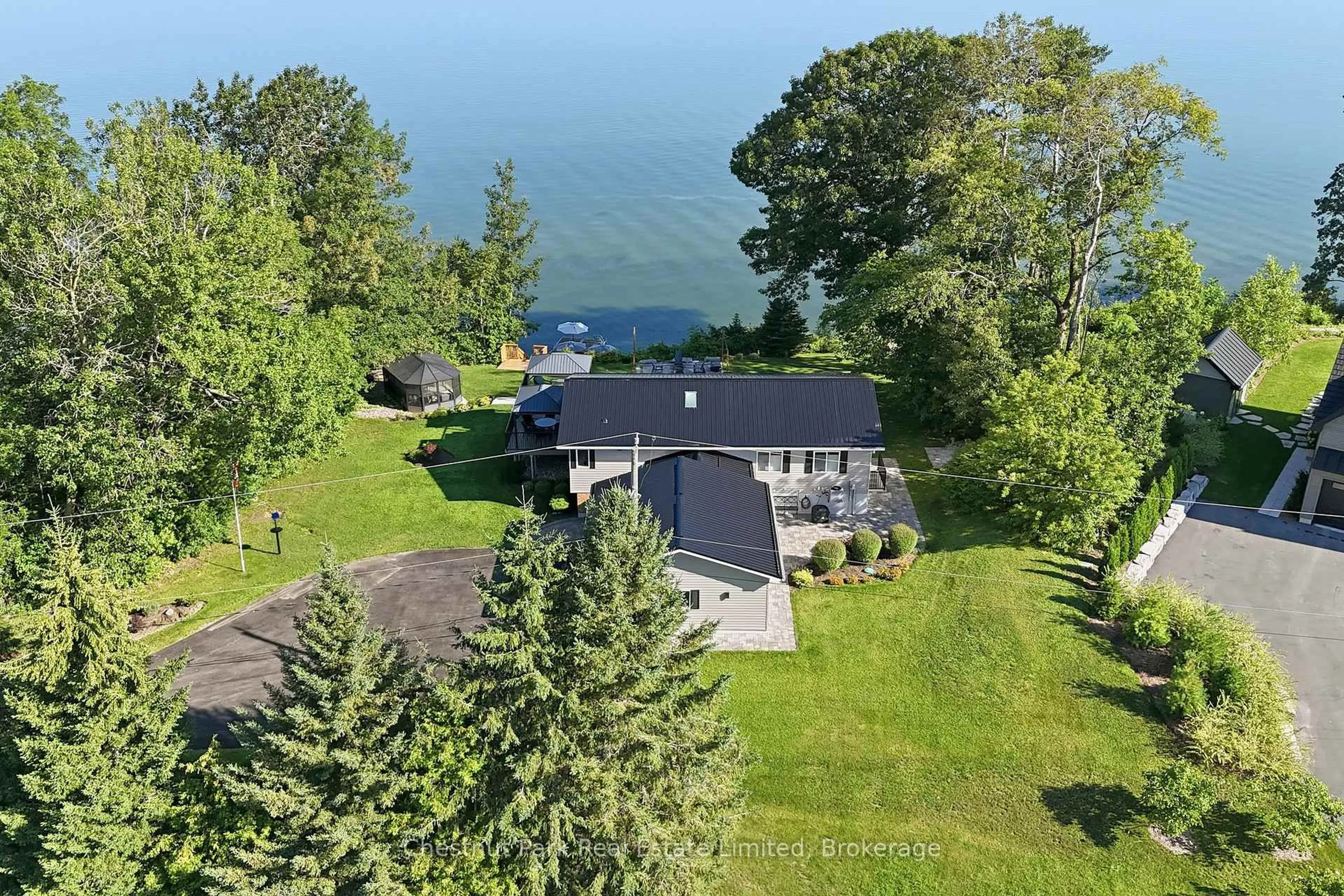 A pic from outside/outdoor area/front of a property/back of a property/a pic from drone, water/lake/river/ocean view for 4 Trumble Lane, Prince Edward County Ontario K0K 2T0