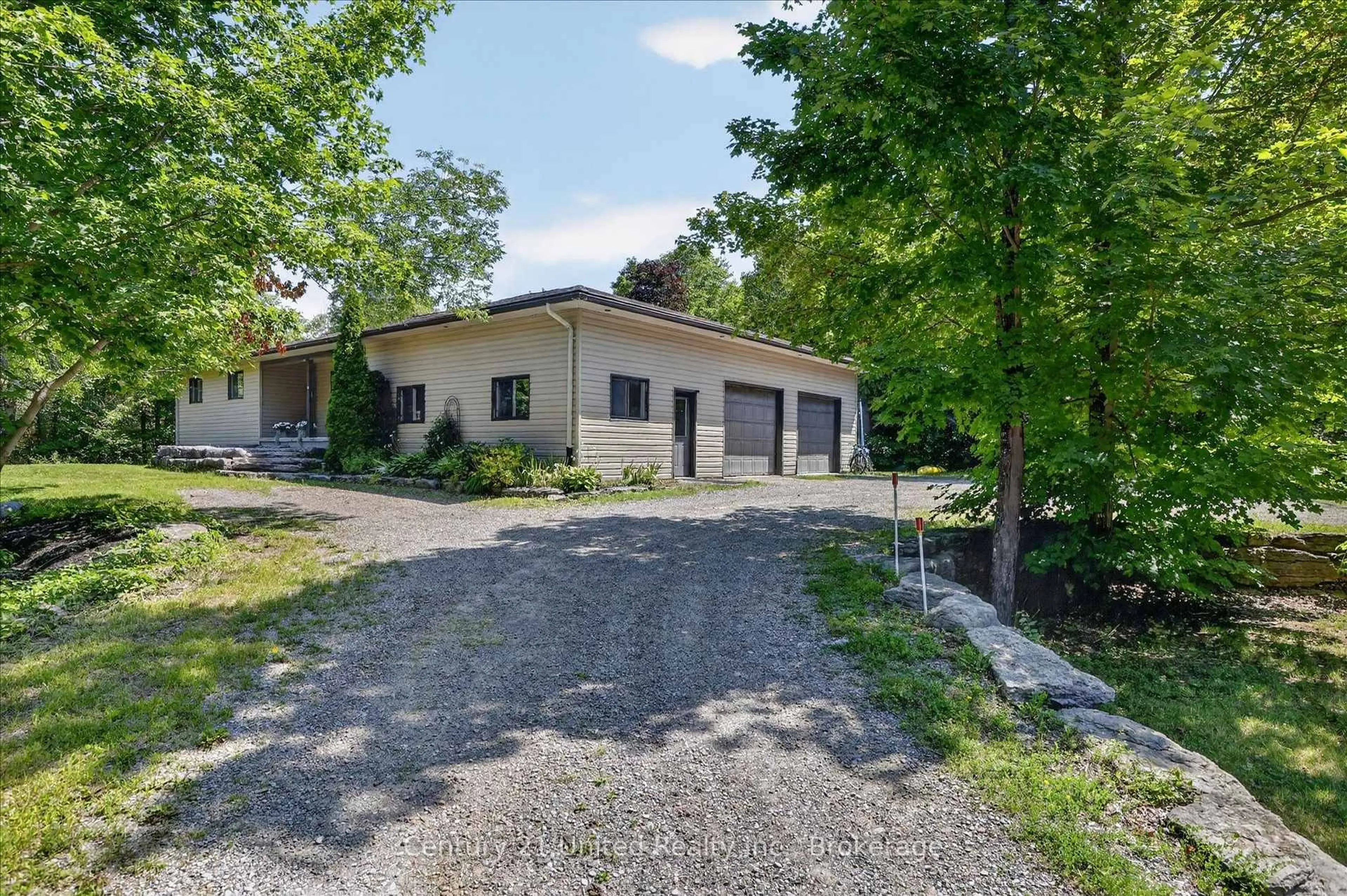 A pic from outside/outdoor area/front of a property/back of a property/a pic from drone, street for 923 Rock Rd, Douro-Dummer Ontario K0L 3A0