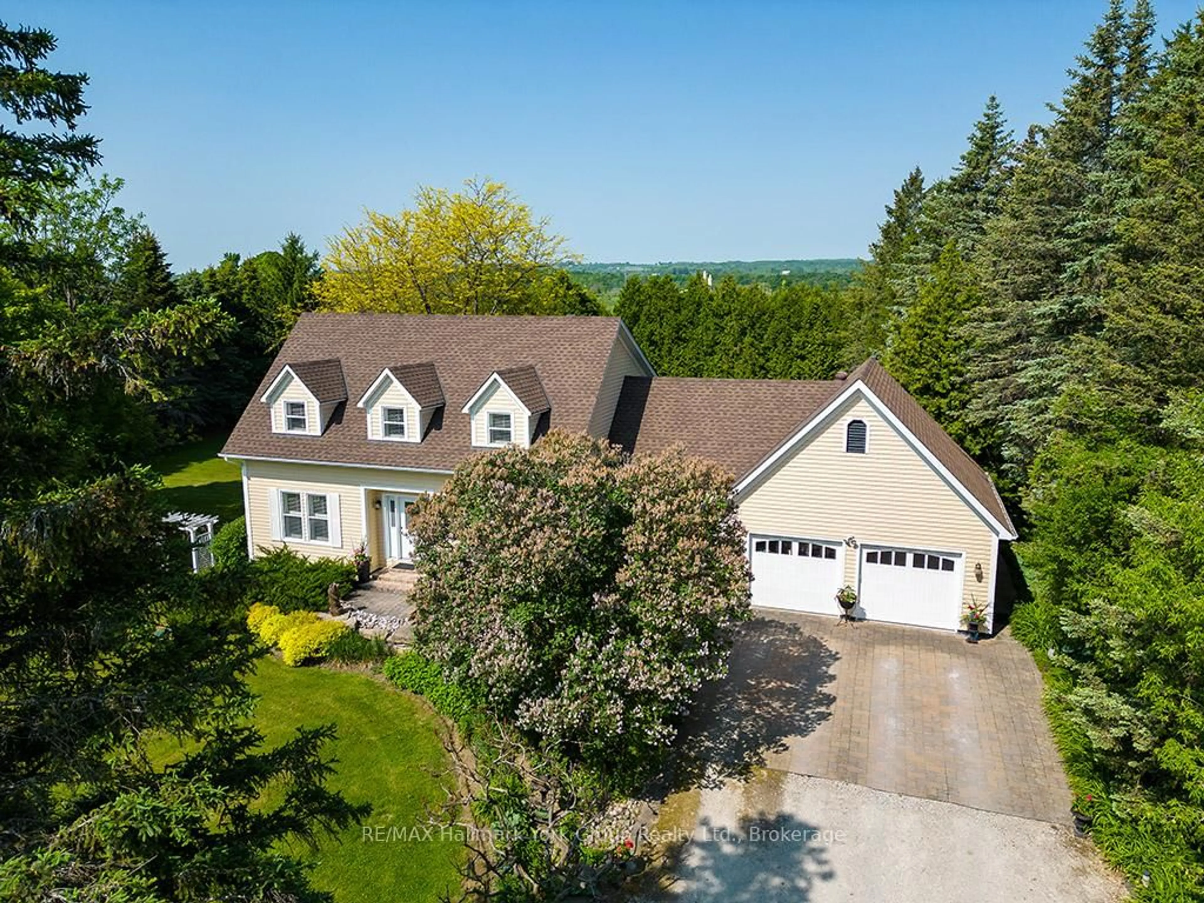 A pic from outside/outdoor area/front of a property/back of a property/a pic from drone, street for 788267 Grey 13 Rd, Blue Mountains Ontario N0H 1J0