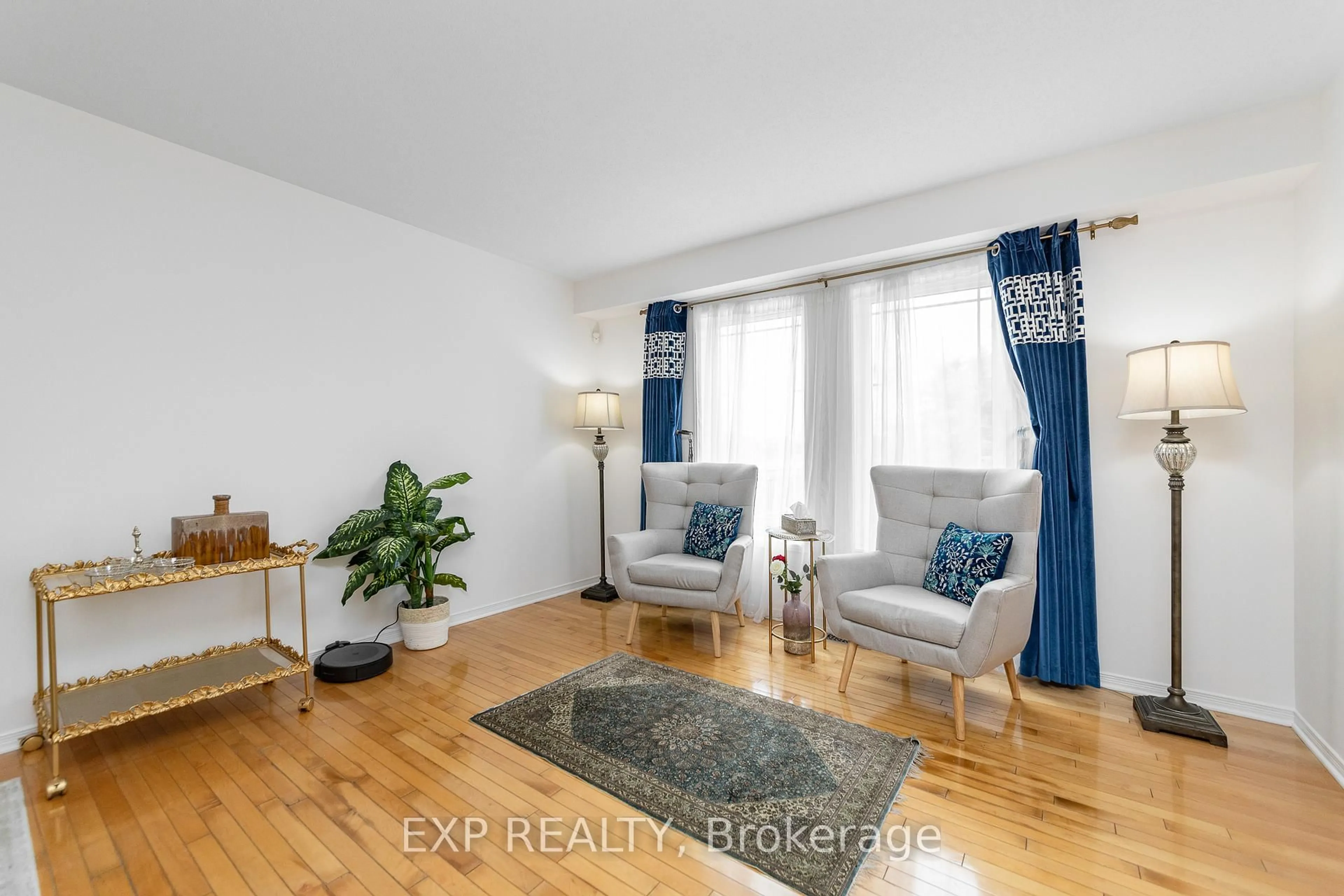 Living room with furniture, wood/laminate floor for 221 Northwind St, Ottawa Ontario K4A 5G3