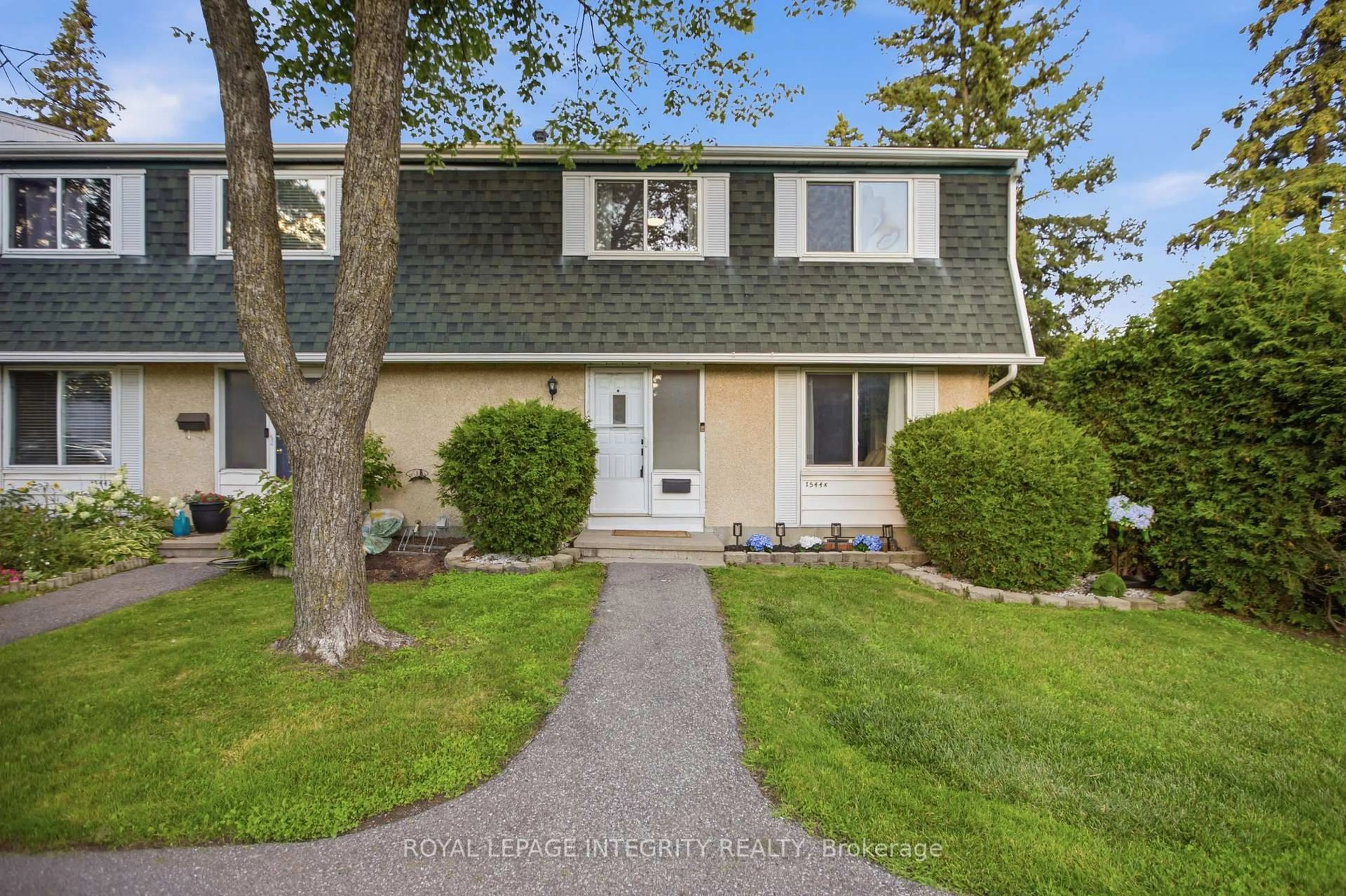 Home with vinyl exterior material, street for 1544K Beaverpond Dr, Ottawa Ontario K1B 3R9