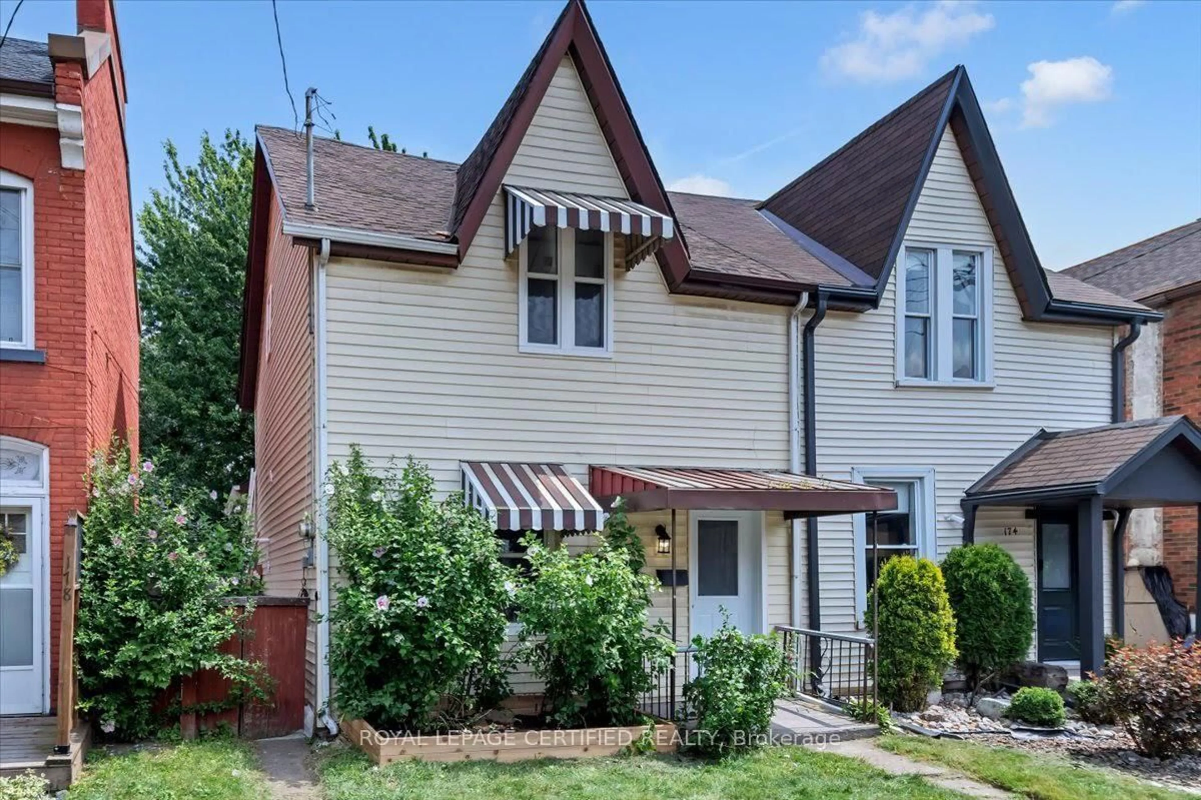 Home with vinyl exterior material, street for 176 Emerald St, Hamilton Ontario L8L 5K8