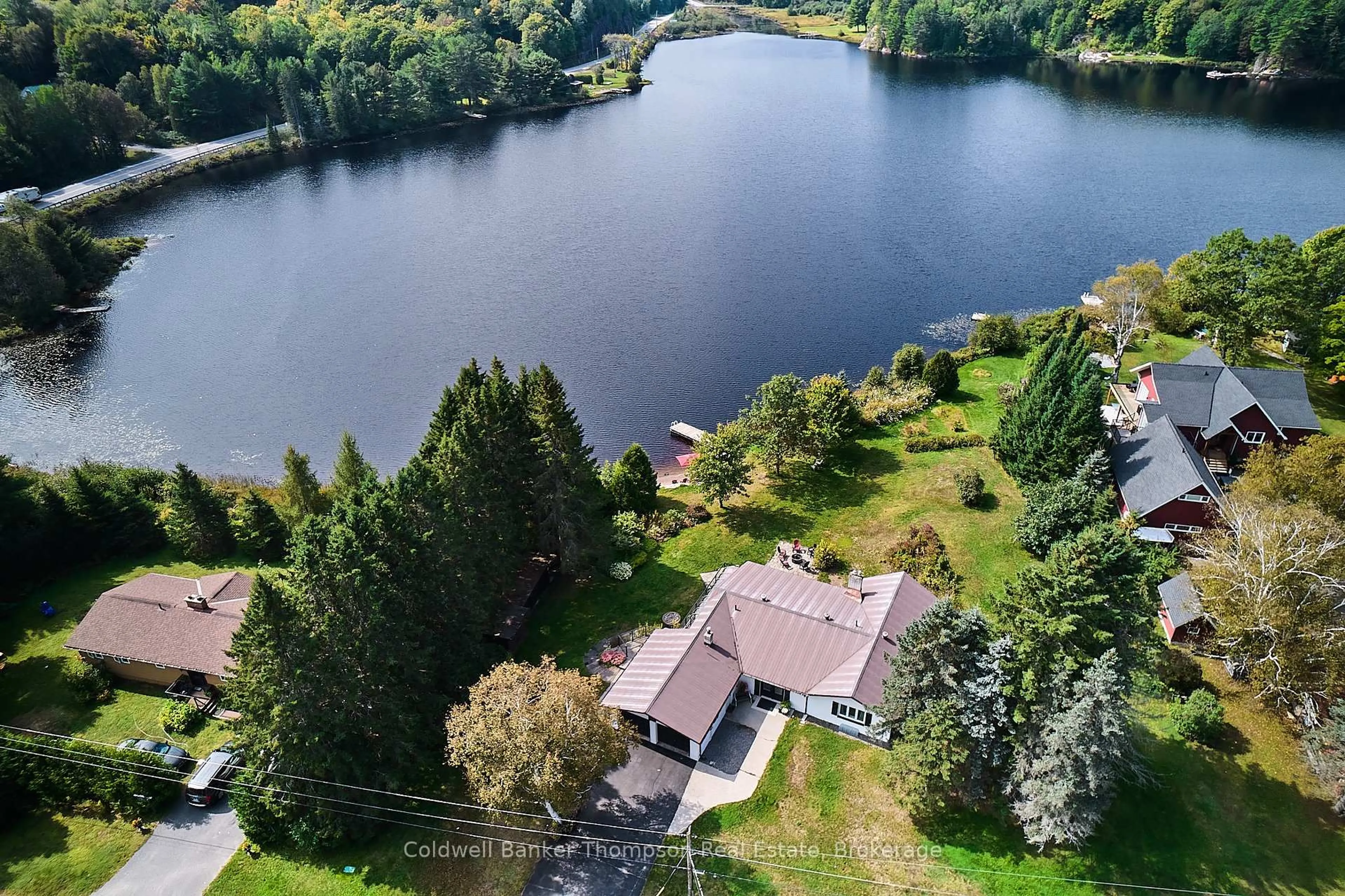 A pic from outside/outdoor area/front of a property/back of a property/a pic from drone, water/lake/river/ocean view for 32 Beach Rd, Huntsville Ontario P0B 1M0