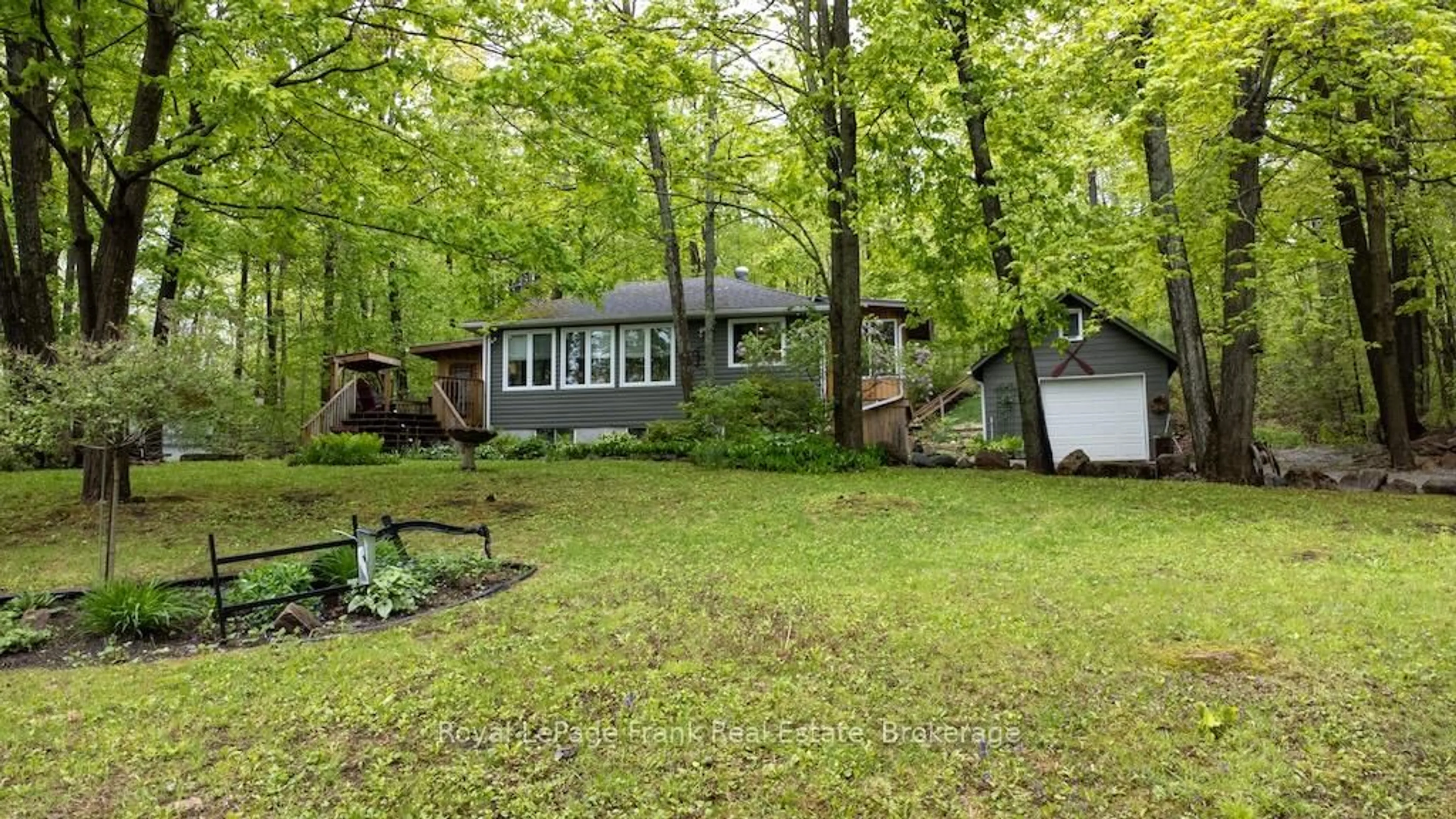 A pic from outside/outdoor area/front of a property/back of a property/a pic from drone, forest/trees view for 3 Fire Route 27B, Trent Lakes Ontario K0L 1J0