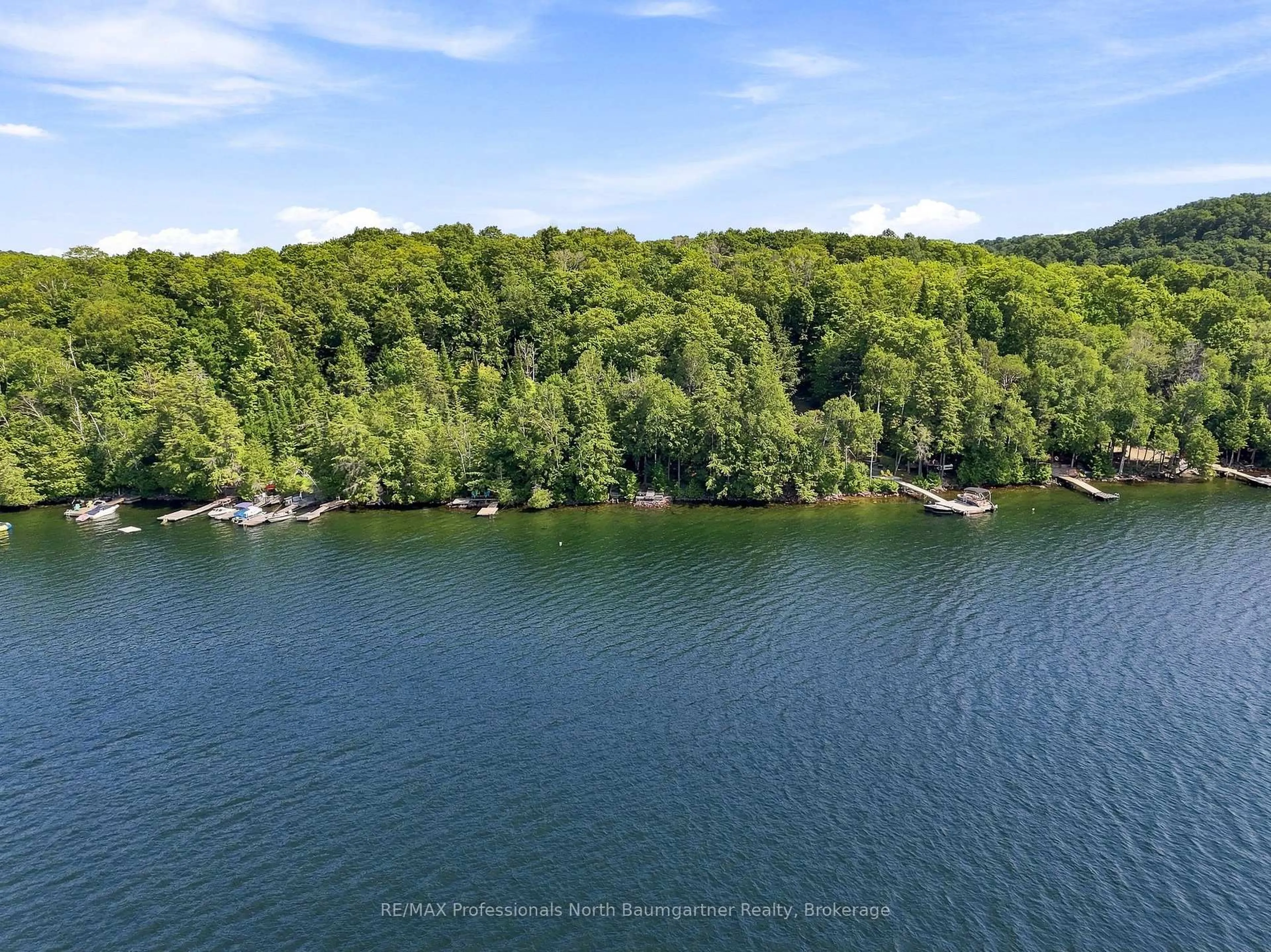 A pic from outside/outdoor area/front of a property/back of a property/a pic from drone, water/lake/river/ocean view for 2183 Trapper's Tr, Dysart et al Ontario K0M 1S0