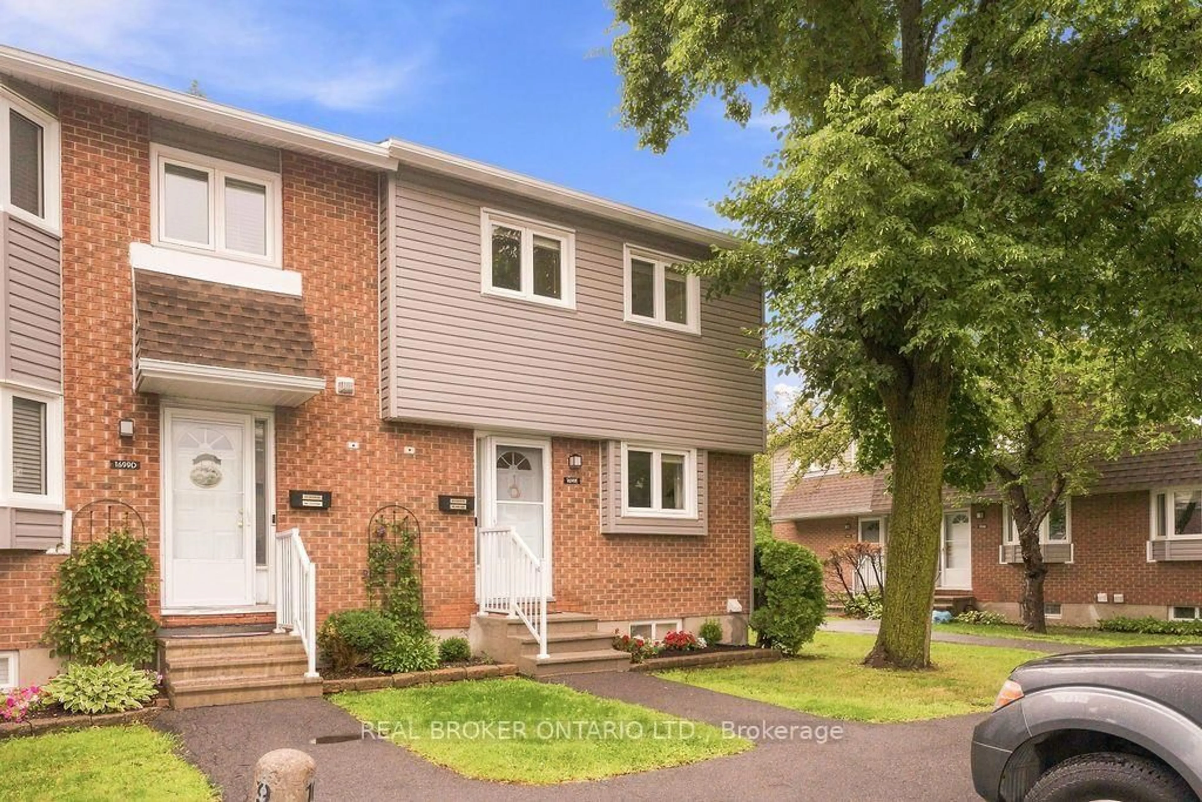 Home with brick exterior material, street for 1699E Lamoureux Dr, Ottawa Ontario K1E 2N3