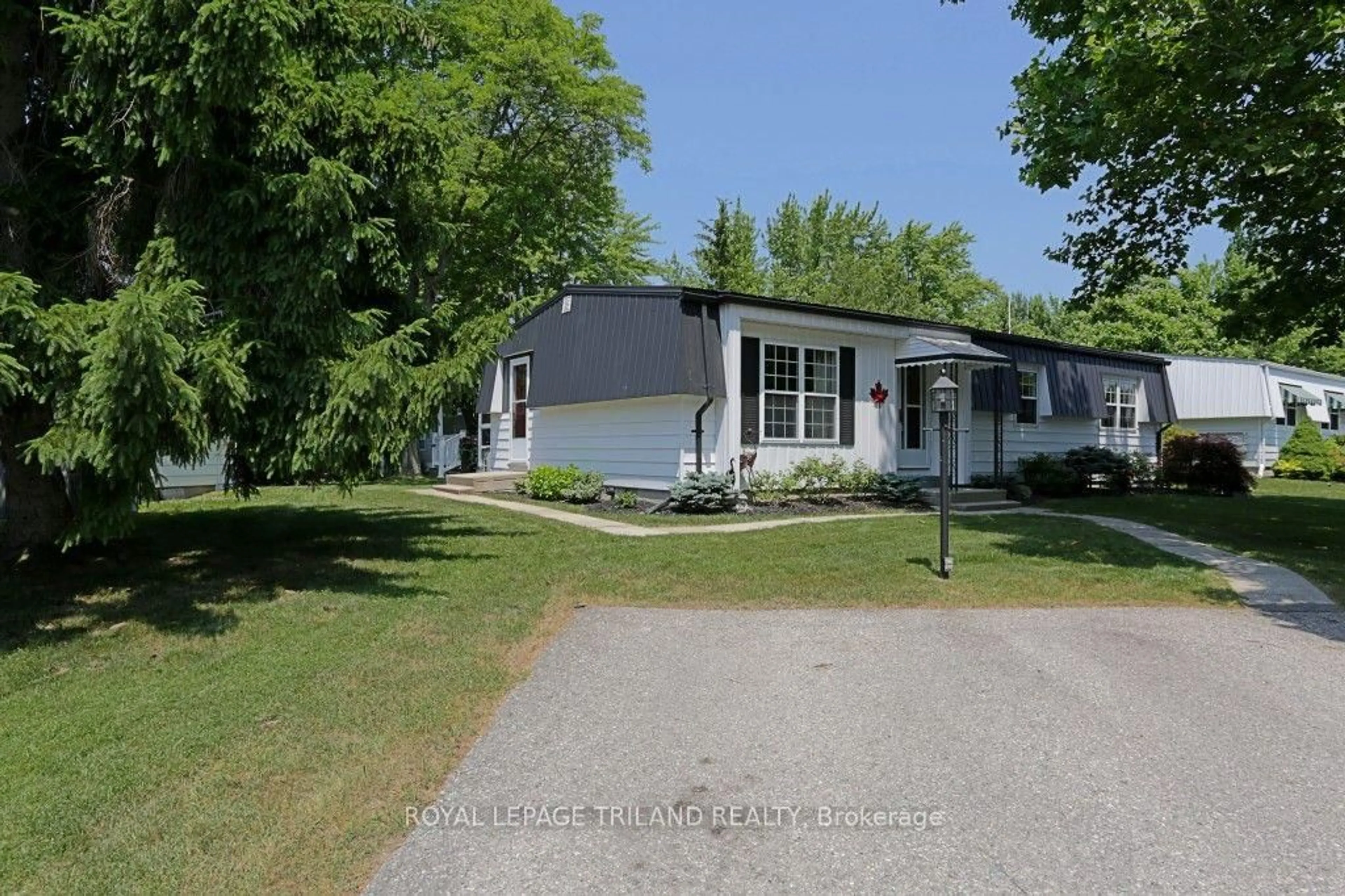A pic from outside/outdoor area/front of a property/back of a property/a pic from drone, street for 314 Wyldwood Lane, South Huron Ontario N0M 1T0