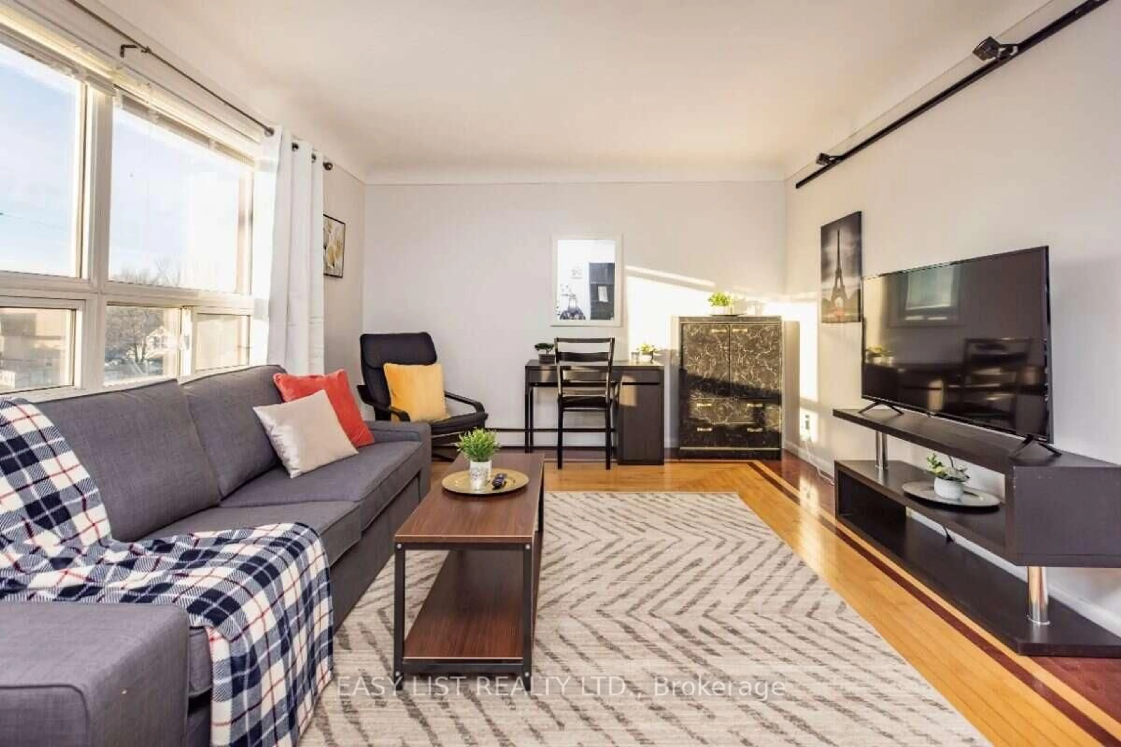 Living room with furniture, unknown for 203 Marier Ave, Ottawa Ontario K1L 5R6