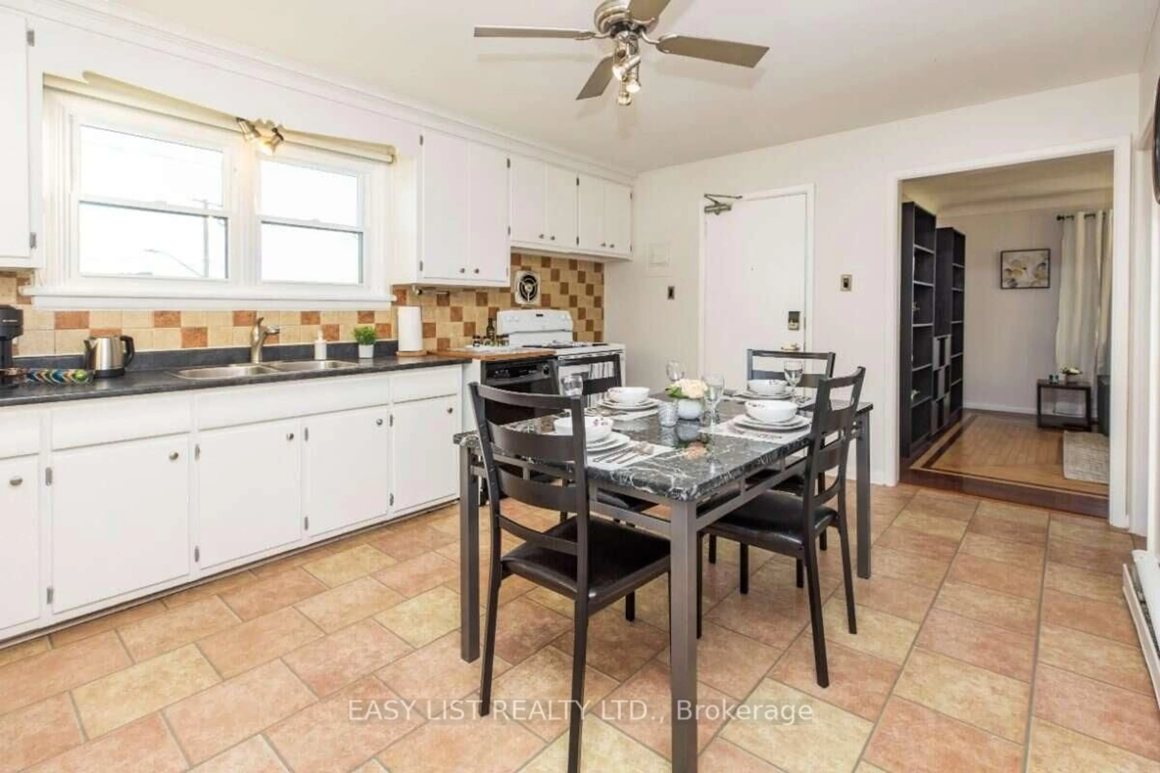 Open concept kitchen, ceramic/tile floor for 203 Marier Ave, Ottawa Ontario K1L 5R6
