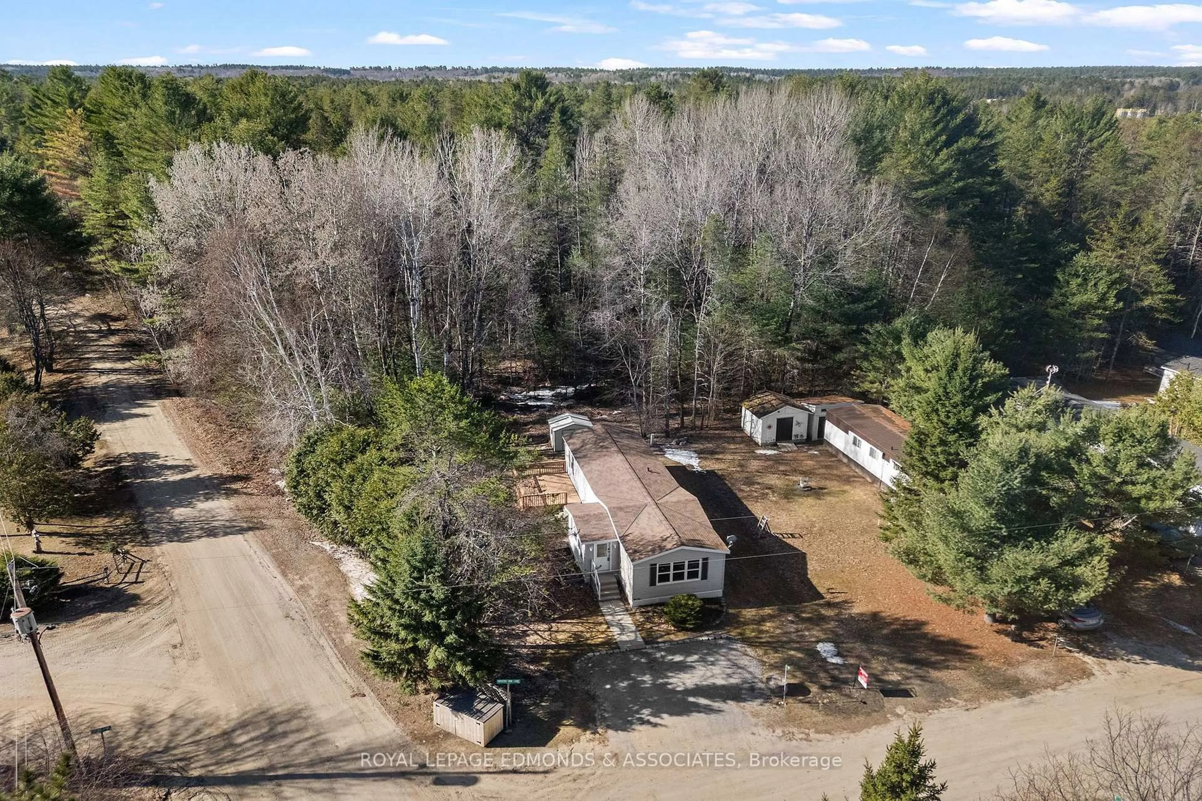 A pic from outside/outdoor area/front of a property/back of a property/a pic from drone, forest/trees view for 5 Hunters Run Lane, Chalk River Ontario K0J 1J0