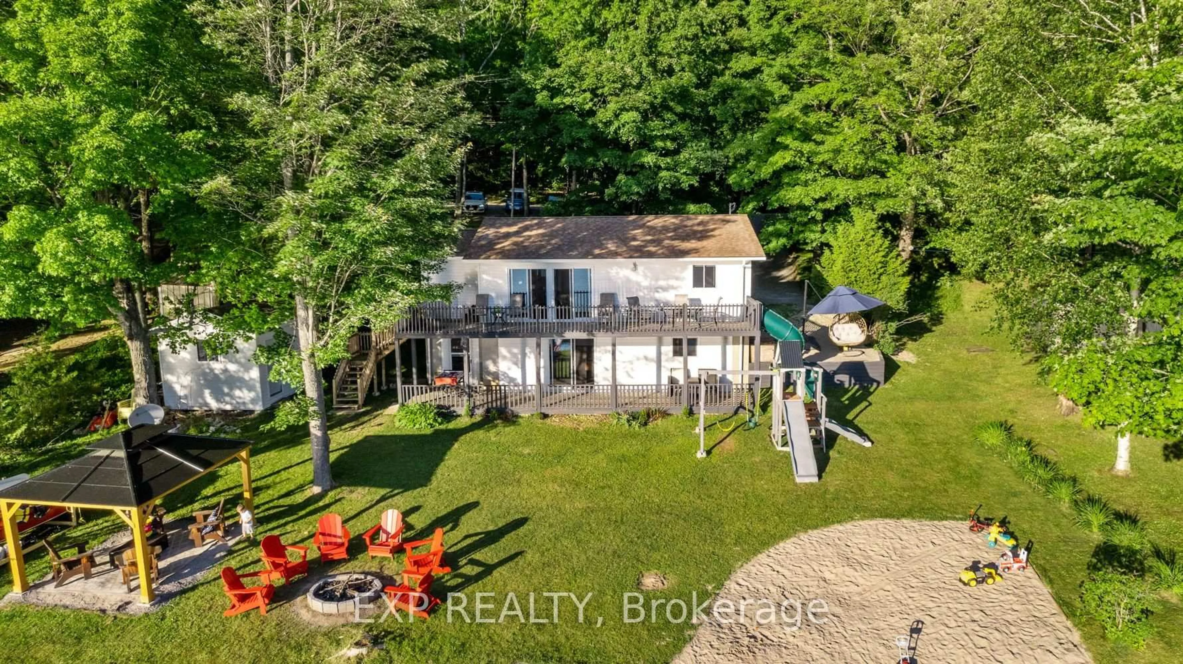 A pic from outside/outdoor area/front of a property/back of a property/a pic from drone, water/lake/river/ocean view for 25 Fire Rt. 296, Trent Lakes Ontario K0L 1J0