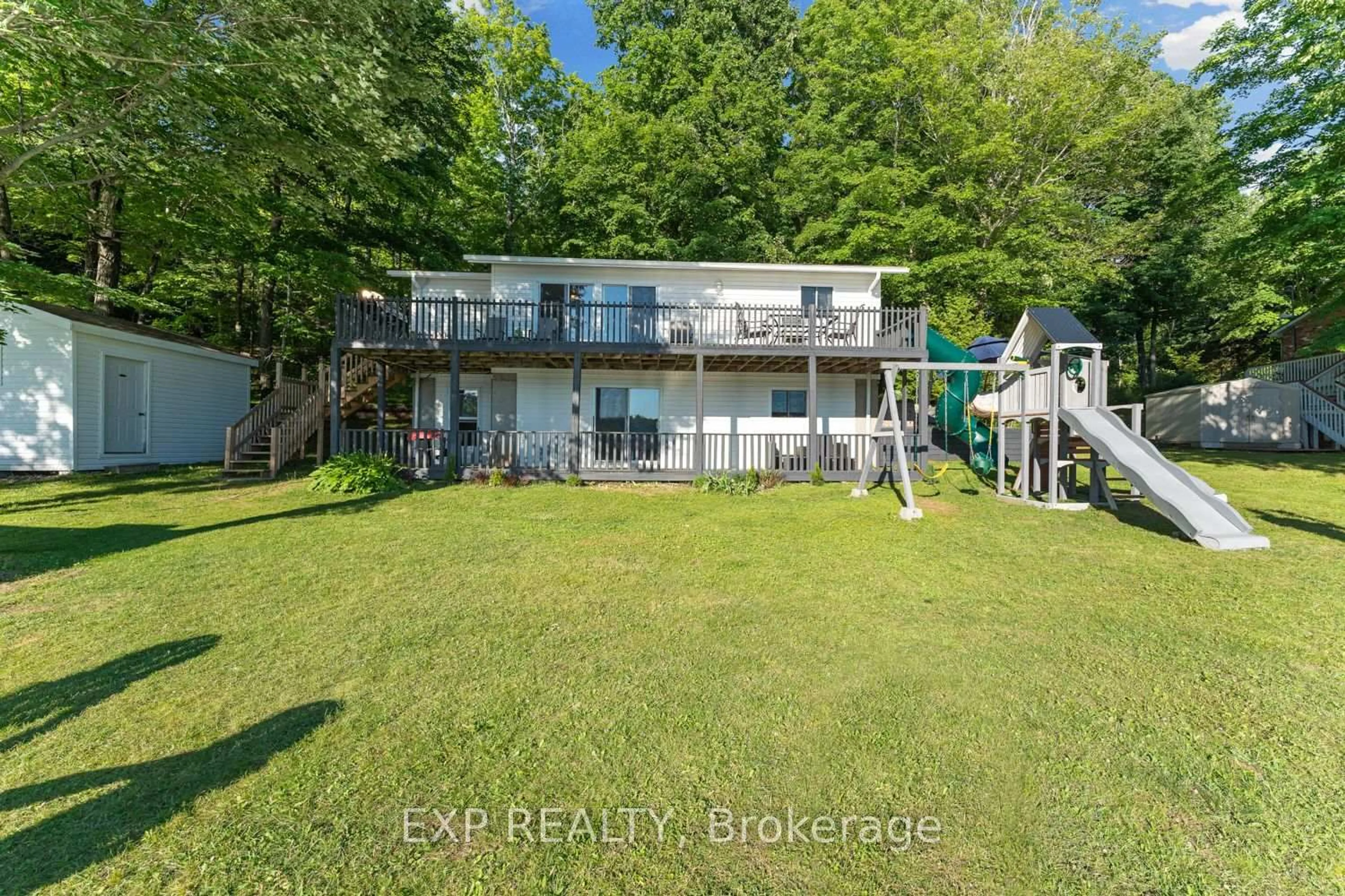 A pic from outside/outdoor area/front of a property/back of a property/a pic from drone, water/lake/river/ocean view for 25 Fire Rt. 296, Trent Lakes Ontario K0L 1J0