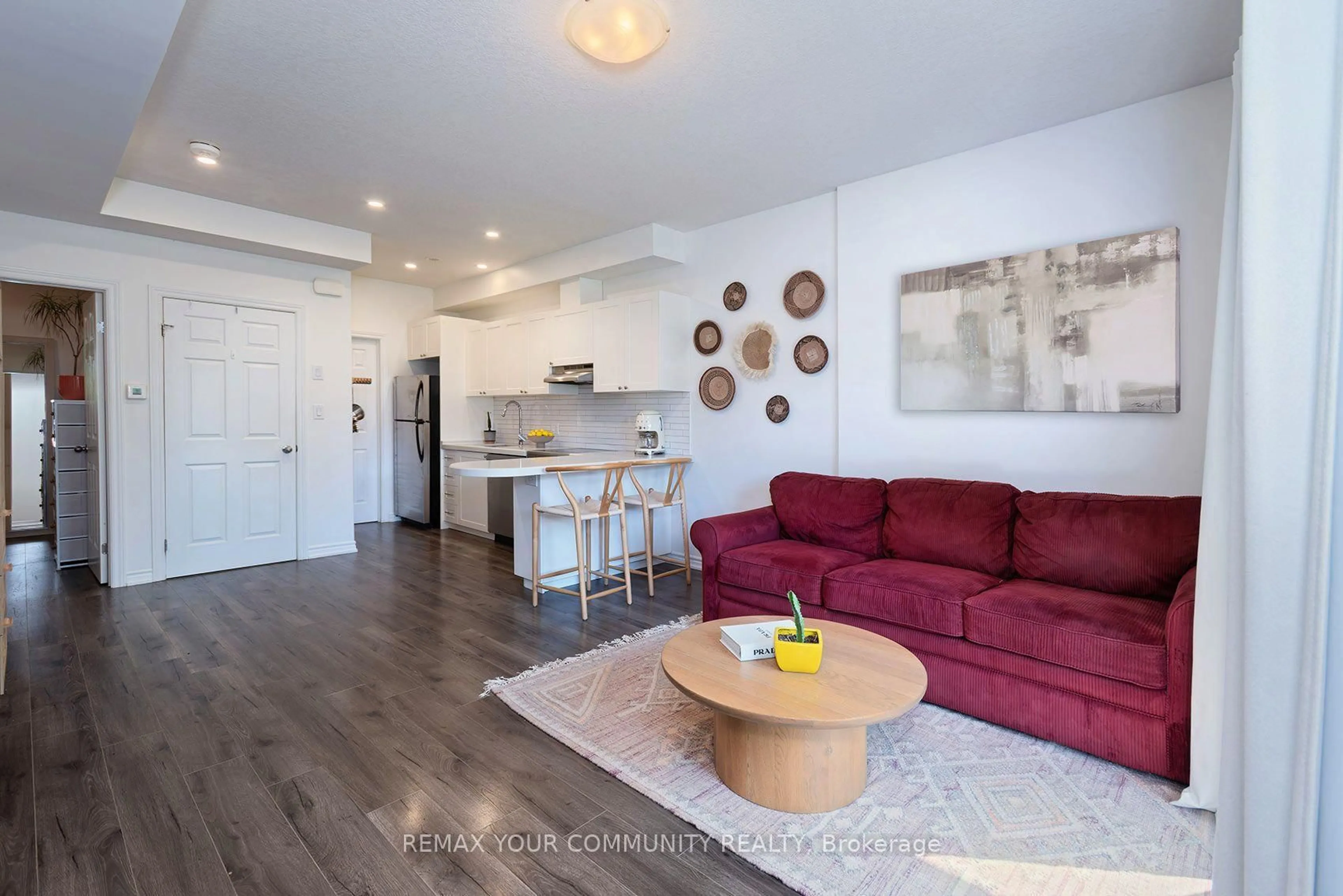 Living room with furniture, wood/laminate floor for 164 Heiman St #6B, Kitchener Ontario N2M 0B8