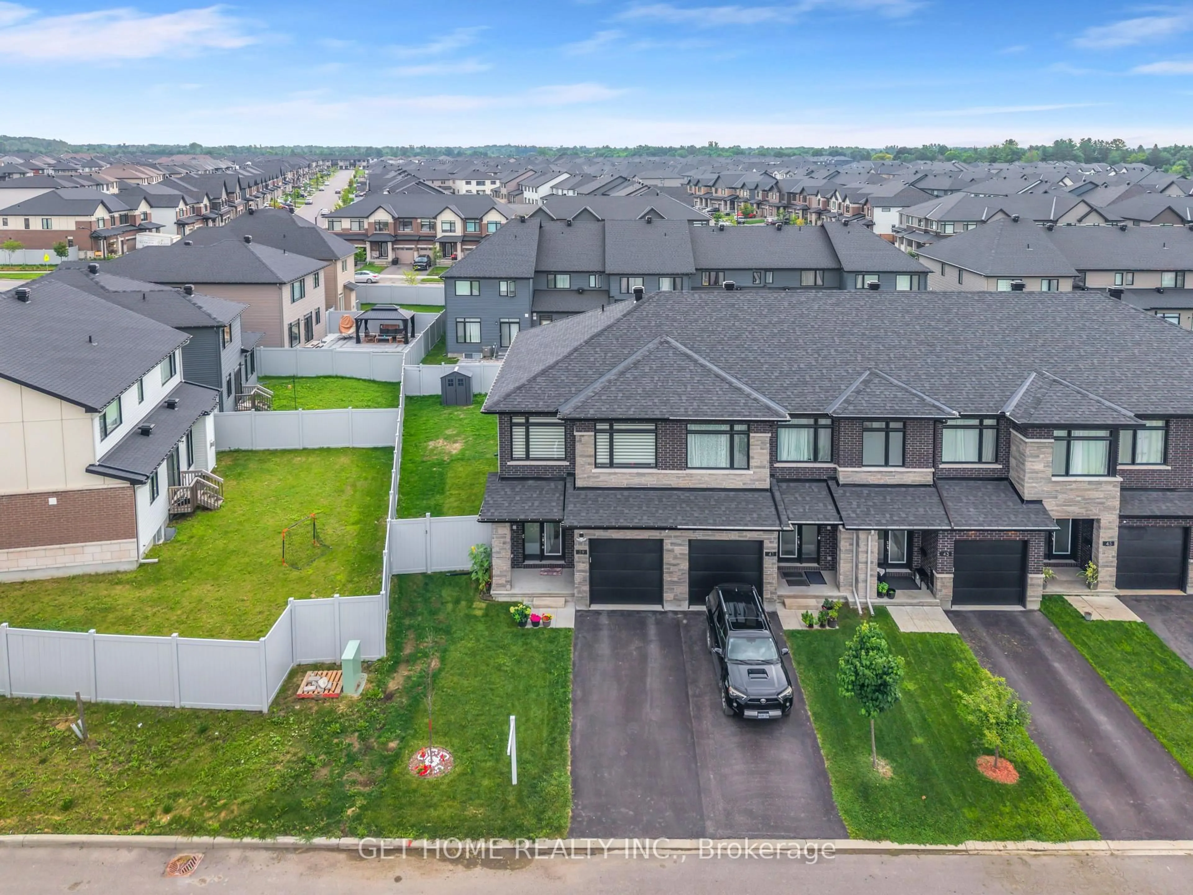A pic from outside/outdoor area/front of a property/back of a property/a pic from drone, unknown for 39 Hermes Ave, Ottawa Ontario K4M 0K7