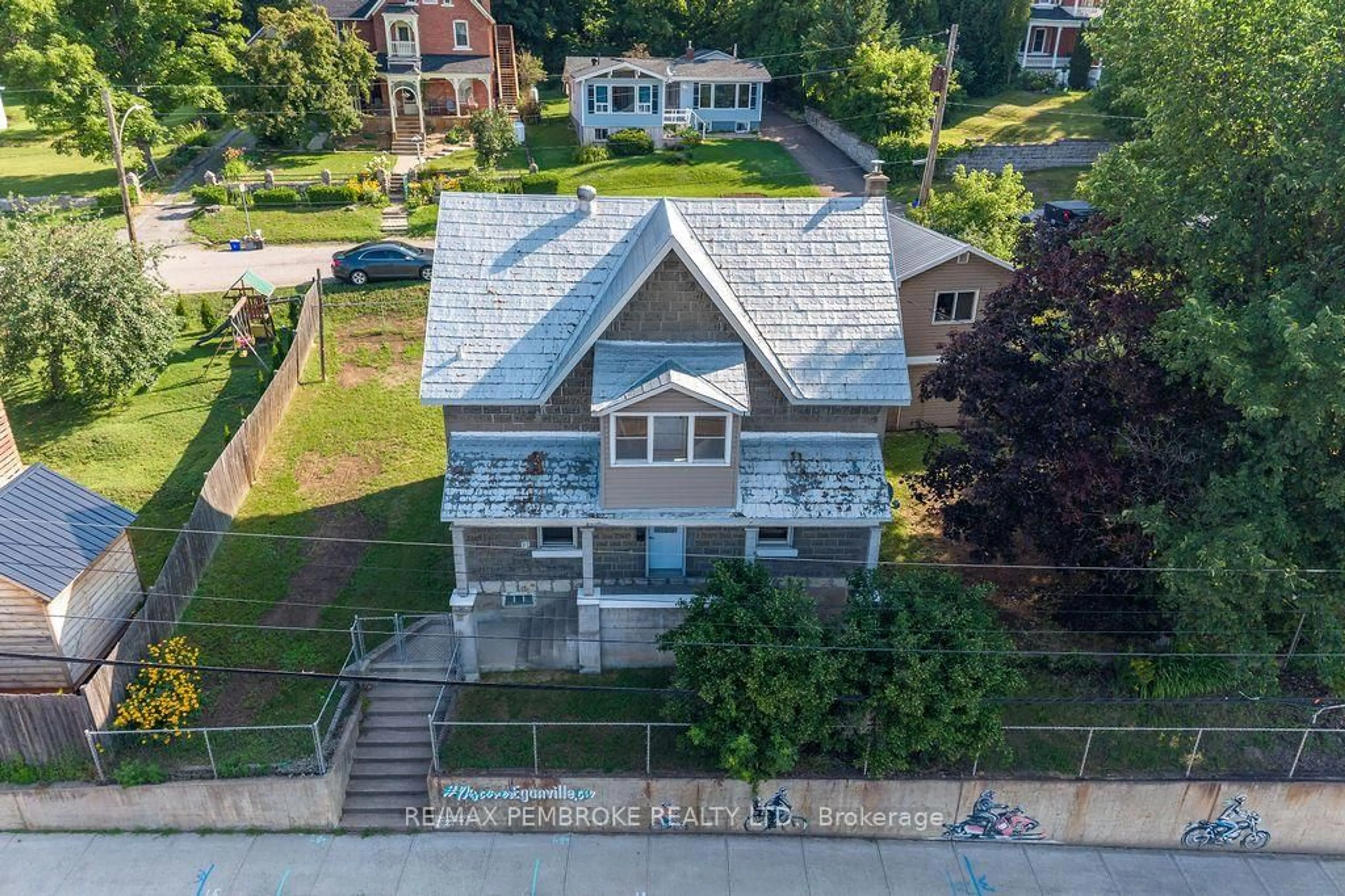 A pic from outside/outdoor area/front of a property/back of a property/a pic from drone, unknown for 131 Bonnechere St, Eganville Ontario K0J 1T0