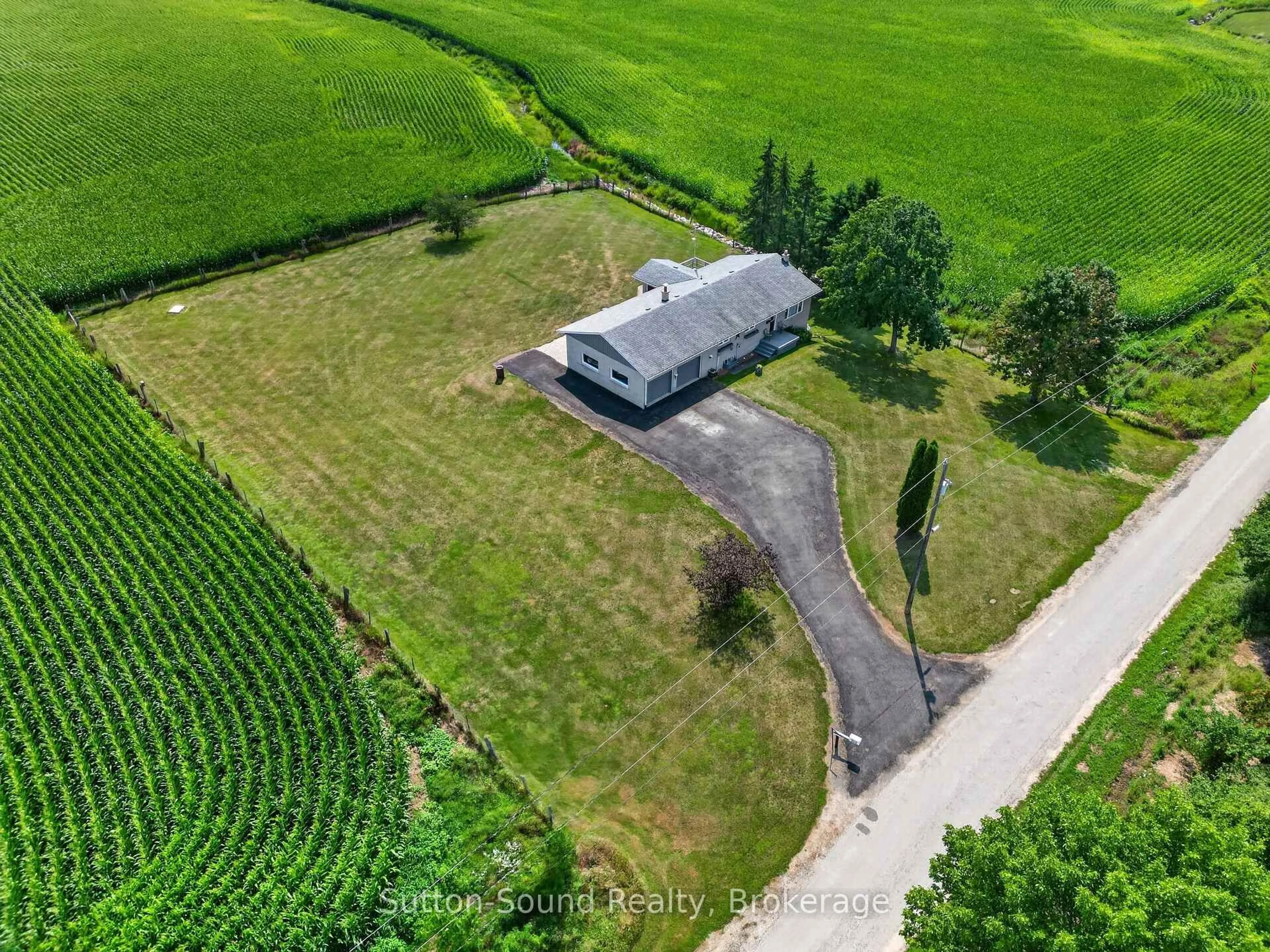 A pic from outside/outdoor area/front of a property/back of a property/a pic from drone, unknown for 383256 DAWSON Rd, Georgian Bluffs Ontario N0H 1S0