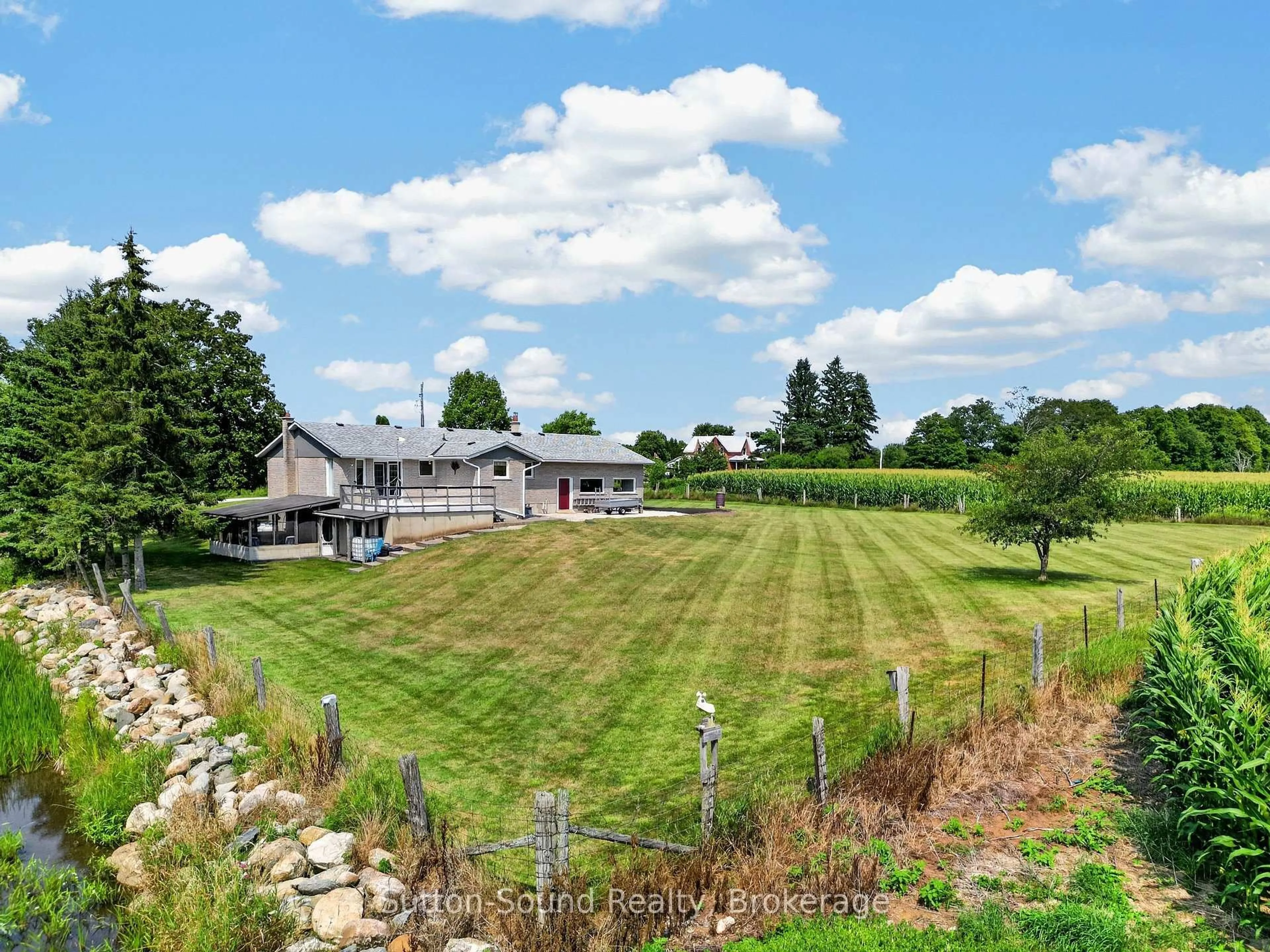 A pic from outside/outdoor area/front of a property/back of a property/a pic from drone, water/lake/river/ocean view for 383256 DAWSON Rd, Georgian Bluffs Ontario N0H 1S0