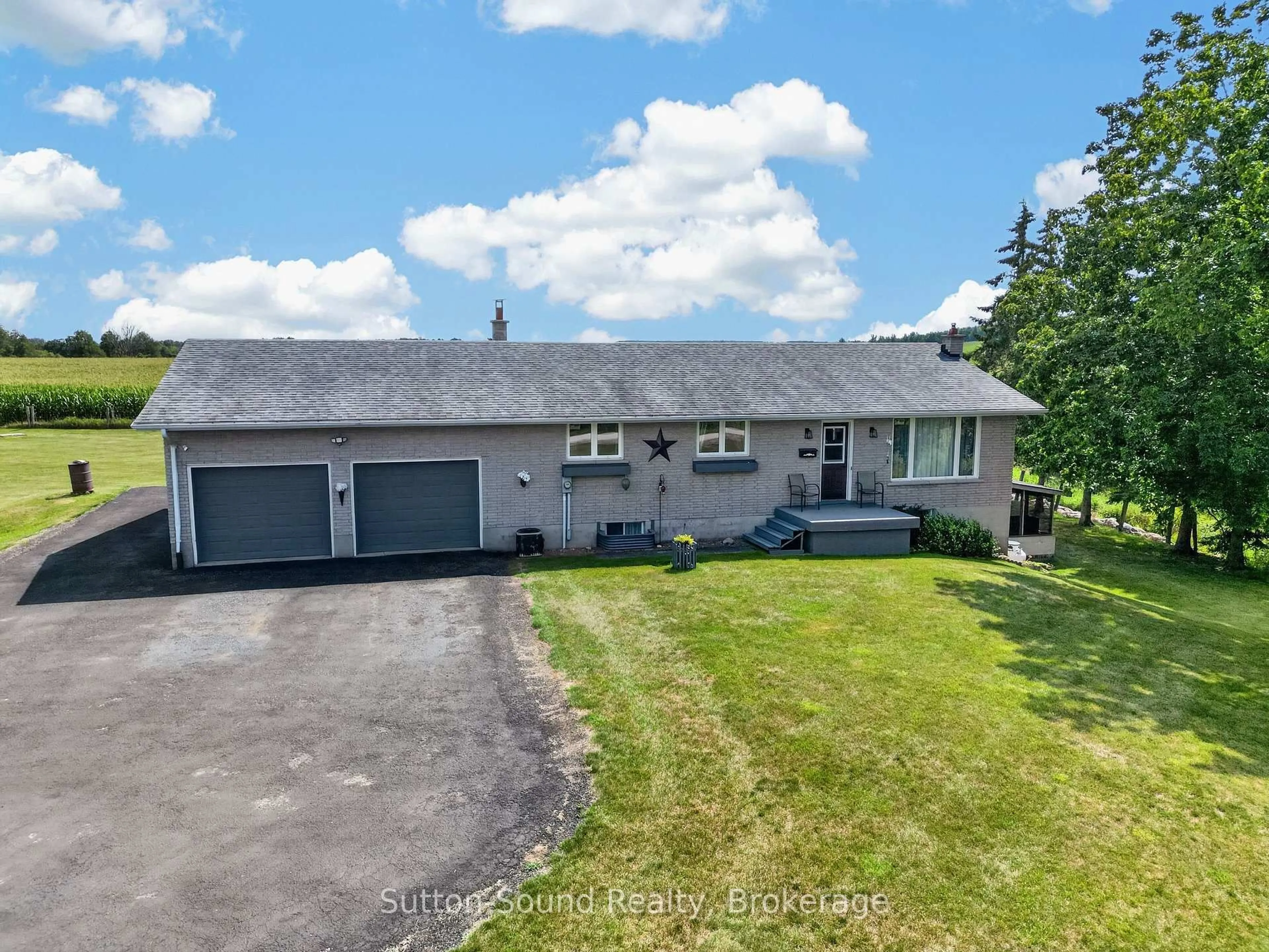 A pic from outside/outdoor area/front of a property/back of a property/a pic from drone, street for 383256 DAWSON Rd, Georgian Bluffs Ontario N0H 1S0